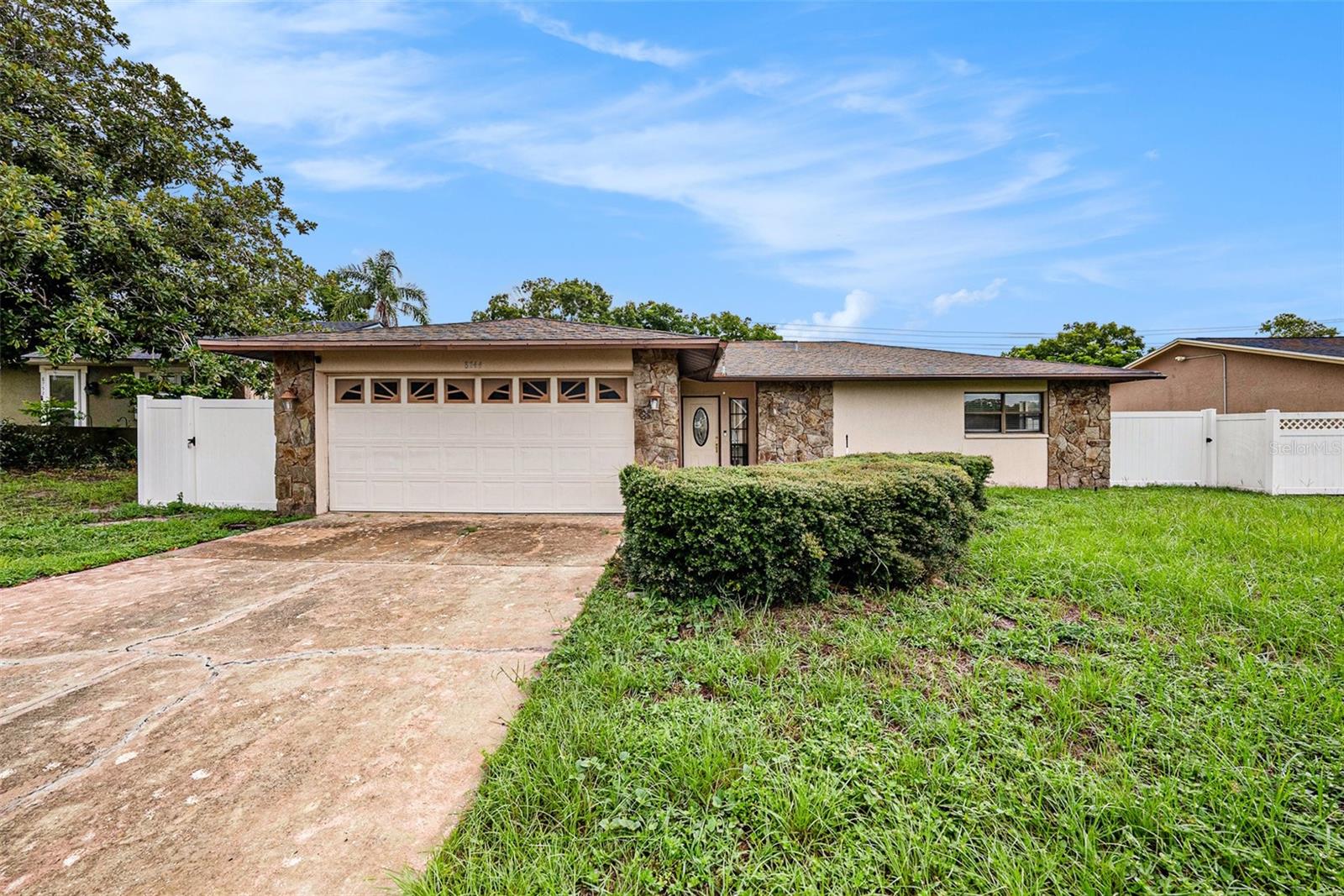 Seller is very Motivated!!! This gem in Port Richey offers 2 beds, 2.5 baths, pool, 2 dining rooms and an open concept kitchen. A 2nd living room can convert into a 3rd bedroom. Enjoy the cozy fireplace, terrace, and pool access from multiple points. A bonus room in the garage is perfect as a workspace, or an additional bedroom. Close to schools, shops and more- don't miss this opportunity