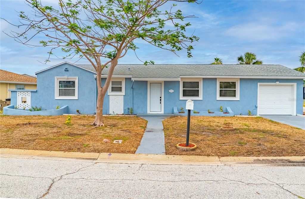 Photo of 410 Virginia Avenue, Madeira Beach, FL 33708 (MLS # TB8393858)