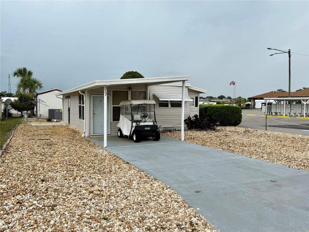 Photo of 317 Golf Crest Lane #58, Davenport, FL 33837 (MLS # TB8509111)