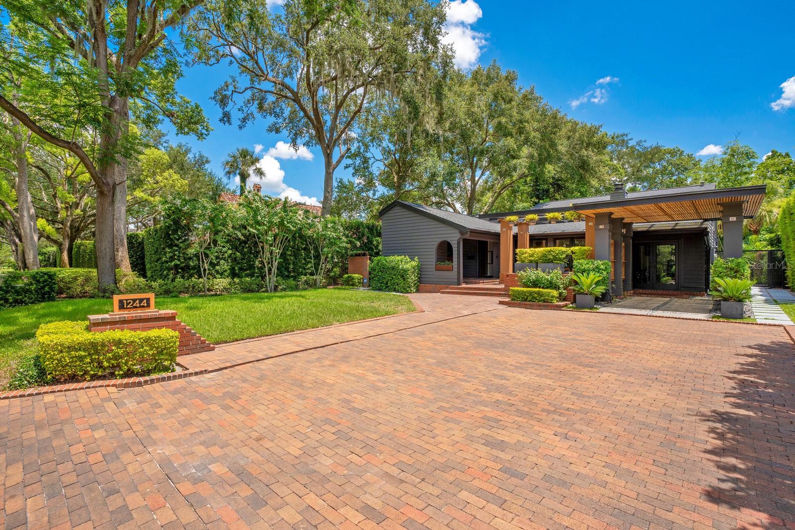 Stunning Mid-Century Modern Home in the Prestigious Via’s of Winter Park.
Architecturally significant custom residence offering an impressive 2,505 sq ft of thoughtfully designed living space. This exceptional property features three spacious bedrooms, three modern bathrooms, an office, and a loft, making it perfect for families or those who work from home.
The owner/architect undertook a complete renovation from 2019 to 2020, preserving the home’s original design while incorporating contemporary upgrades. The striking exterior boasts a new roof, elegant new columns, and stylish French doors that enhance curb appeal. Inside, you’ll be greeted by high ceilings that create an open and airy atmosphere, complemented by oak flooring and cedar trim accents throughout.
The heart of the home is the bright kitchen with abundant natural light from large windows and skylights. Equipped with premium Dacor appliances and custom cabinetry, this space is perfect for culinary enthusiasts. The convenient pass-through allows easy service to the dining room and back deck, ideal for entertaining friends and family.
The master suite is located in its own private wing. It features high ceilings and large custom windows that bring the outside in with views of the backyard and Zen garden. The large master bathroom includes custom windows, separate sink and make-up vanities, custom walk-in closet, soaking tub, and walk-in shower that transitions into an outdoor shower that feels like a private oasis. All the updated bathrooms feature modern fixtures and finishes, ensuring comfort and style.
Step outside to the private backyard surrounded by mature landscaping. The outdoor firepit area is a perfect setting for outdoor gatherings or quiet relaxation. This is a tranquil retreat with ample space to accommodate a future pool and/or separate living structure.
The renovation of this property included two new HVAC systems, two tankless hot water heaters for endless hot water, new French doors, windows, skylights, and energy-efficient LED lighting throughout the home. The property includes a carport with a level 2 EV charger. There is plenty of storage areas inside the house and there are also two large exterior, lockable sheds.
Located just a short walk from Kraft Azalea Gardens, Lake Knowles, and the vibrant shopping and dining options along Park Avenue, this home combines luxury living with an unbeatable location. This exquisite mid-century modern retreat offers the perfect balance of charm, functionality, and modern amenities in an A+ location.
