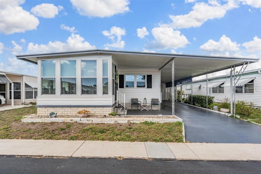 This beautifully updated 2-bedroom, 2-bath home offers nearly 1,200 sq. ft. of move-in-ready living space with numerous recent upgrades. Interior improvements include luxury vinyl plank flooring with new subfloors (2023), fresh interior paint, new ceiling fans, and new windows (2023). The fully renovated kitchen (2023) features stainless steel appliances, modern cabinetry, updated countertops, and a stylish backsplash.
The bright Florida Room recently received new windows and is perfect for relaxing with morning coffee or entertaining friends. A flexible bonus room off the kitchen can be used as a home office, sitting room, or hobby space. The spacious primary suite includes a walk-in closet and updated en-suite bath with tiled walk-in shower, while the guest bedroom and bath provide comfortable accommodations for visitors.
Exterior features include vinyl siding, attractive landscaping, a cozy outdoor sitting area, covered carport, and an 8x12 storage shed with washer and dryer. Major updates include roof-over (2018) and A/C (2017).
Price includes the $35,000 resident share. Conveniently located near beautiful Gulf beaches, shopping, dining, and all that the St. Pete/Tampa area has to offer.
Palm Hill Country Club, a vibrant 55+ resort-style community in Largo offering an active Florida lifestyle with abundant amenities and social activities. The low monthly maintenance fee includes water, sewer, trash, lawn care, cable, and internet, providing convenient and affordable living.
Schedule your private showing today and start enjoying the Florida retirement lifestyle!