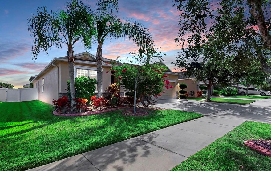 Welcome to this beautifully updated home with 4 spacious bedrooms, 3 full bathrooms, a rare 3-car garage, screened-in lanai, and a fully fenced backyard located in the desirable community of River Bend in Southshore Hillsborough County. The curb appeal is enhanced by thoughtfully designed landscaping that adds vibrant pops of color against the home's elegant neutral exterior. This single-story residence offers over 2,200 sq ft of open living space with a thoughtful 3-way split bedroom layout that includes TWO ENSUITES (primary ensuite AND a guest ensuite), in addition to two more bedrooms that share a hall bath with dual vanities, tub with shower. As you step through the front door, the foyer opens up to the large kitchen, the dining room, the living room and breakfast nook (or bar area). The expansive kitchen - designed with entertaining in mind - features a convenient island, upgraded stainless steel appliances, granite countertops, 42-inch espresso cabinetry, is a chef's dream and a gathering spot for family and friends. All of the formal areas and primary ensuite features crown molding. Retreat to the PRIMARY ENSUITE and discover the epitome of comfort with a huge walk-in closet. Enjoy the convenience of dual sinks, private water closet, accessible shower with fold down seat and unwind in the generously sized garden tub. The private GUEST ENSUITE off the foyer, has a full bathroom with a tub with shower, full size closet, and is the perfect setup as in-law suite, overnight guests or home office. With two additional bedrooms and one more full bathroom with dual sinks, tub with shower, this home is thoughtfully designed to accommodate both family and guests. 18-inch ceramic tile throughout the main living areas— and carpet only in the bedrooms. The inside laundry room includes a utility sink and shelving. The third bay in the garage has been converted into a temporary non-permanent, non-structural workshop. Hurricane shutters come with the home. Off the living room, sliding glass doors lead to the fully fenced in backyard oasis with mature palms. Enjoy the serene ambiance on your screened-in covered lanai—a perfect setting for gatherings and relaxation. Recent upgrades include a hybrid water heater (2024), garage door opener (2024), attic stairs (2024), refrigerator (2023), dishwasher (2023), washer and dryer (2023). There is a second set of washer and dryer hookups in the garage, where the previous owners moved the washer and dryer into the garage, however the current owners moved them back into the inside laundry room (2023). Previous updates include a new HVAC system and water softener (2022). Located just a short walk from River Bend’s amenities including a brand new resort-style swimming pool, splash pad, tennis/pickleball courts, basketball courts, clubhouse, fitness center, playground, fishing ponds, and a dog park—a complete package for a vibrant and fulfilling lifestyle—all with a low annual HOA. Conveniently near Tampa, MacDill Air Force Base, St. Pete, Bradenton and Sarasota. Whether you're traveling for work or leisure, you're only 45 minutes from both Tampa International Airport, St. Pete/Clearwater Airport and Sarasota-Bradenton International Airport, giving you flexibility and ease of travel. This location truly combines convenience, lifestyle, and access to all the Gulf Coast has to offer. This home is move-in ready, exceptionally maintained, and offers outstanding value!