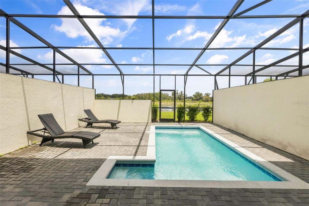 Photo of 7147 Oakmoss Loop, Davenport, FL 33837 (MLS # O6431711)