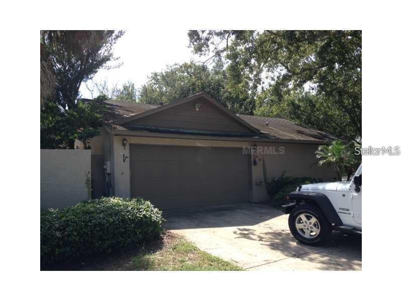 Beautiful open layout 3 bed 2 bath 2 car garage Palm Harbor house. It is a large open layout in a very private setting. Gorgeous kitchen cabinets and light fixtures. Two outside patios: one open and not covered and another screened and covered. Porcelain tile throughout. This house has everything you need and more in a beautiful open layout. Near to many amenities including schools. shopping centers, major highways and much more.