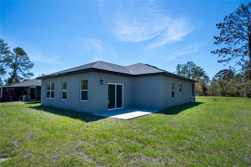 Photo of 5 Fisher Loop, Ocklawaha, FL 32179 (MLS # O6296118)