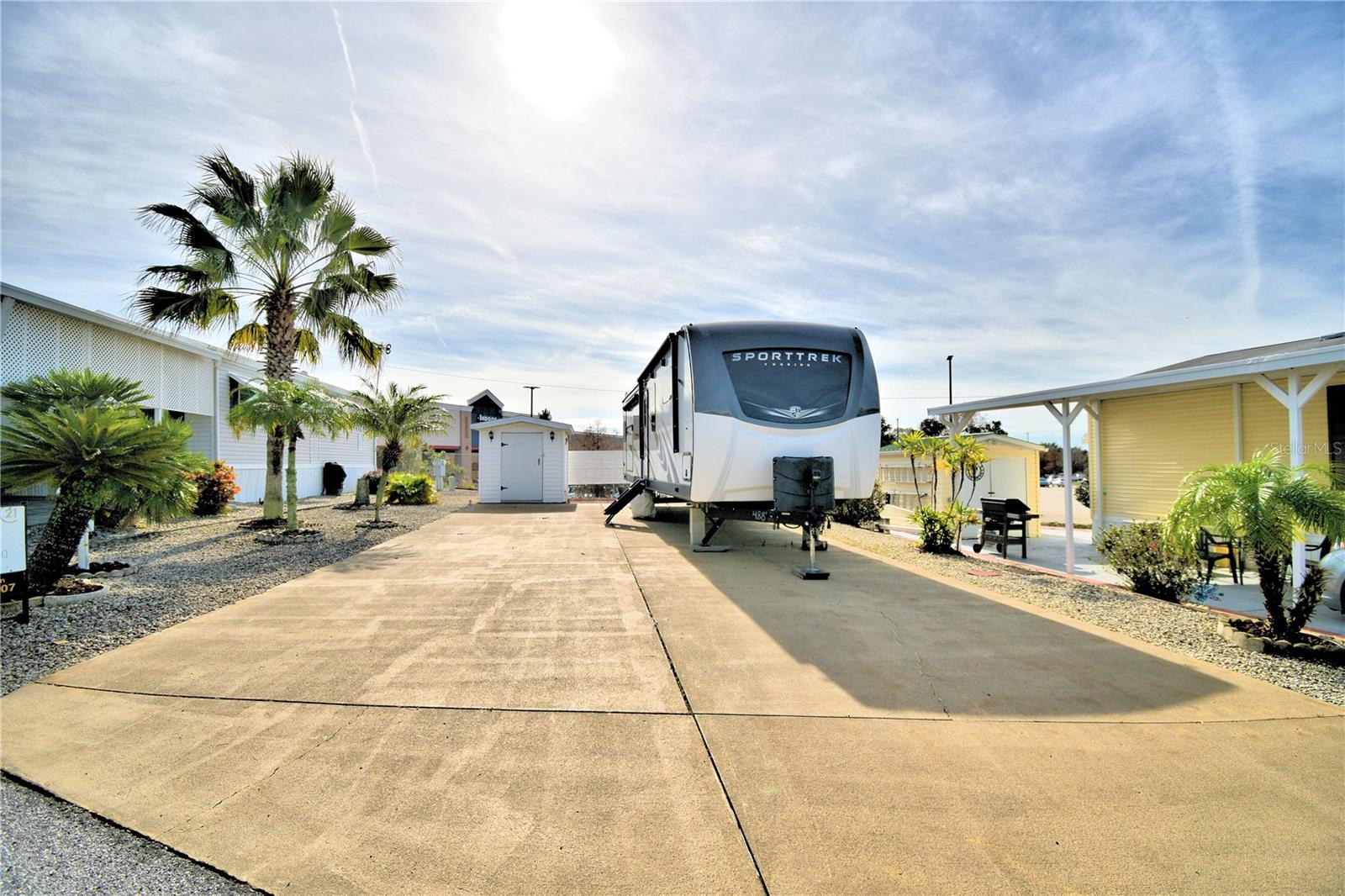 FLORIDA LIVING AT IT'S BEST! THIS 55+COMMUNITY YOU OWN YOUR LAND! Vacant lot for your Class A or 5th WHEEL or ready with for a brand new Park Model or Doublewide MH. Lot provides rock yard for low maintenance and mature landscaping. Shed on property with washer/dryer/electric. GATED Community with Recreational Building, Solar Heater Pool, Mini Putt Putt Golf, Pickle Ball Court, Bocce Ball and so many activities including BINGO, Karaoke and MORE! Close to restaurants/shopping/medical and major highways to our Florida Parks and East/West Coast Beaches. MOTOR HOME HAS BEEN REMOVED! Call today for more details and your showing appointment.