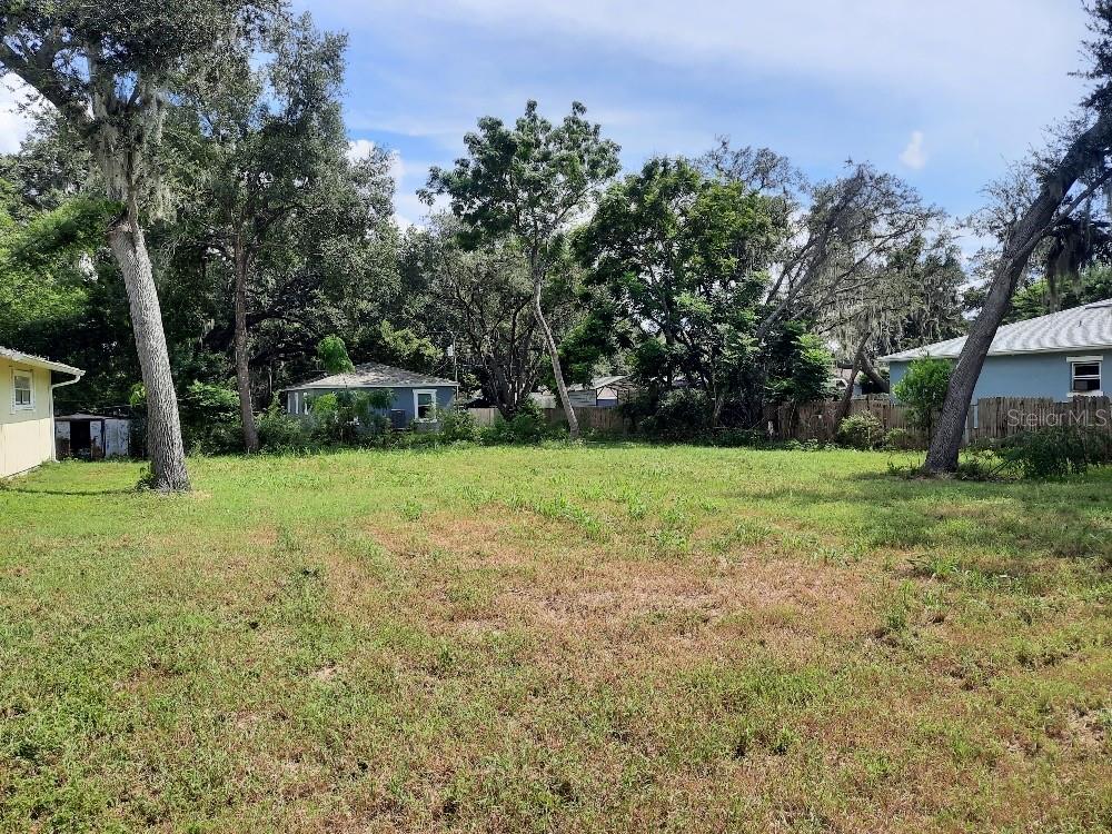 Build your dream home on this spacious lot in the peaceful Bass Lake Estates community of New Port Richey. With majority of trees already cleared, the property offers a versatile canvas for construction and landscaping. Conveniently located just minutes from Little Road, you'll enjoy easy access to dining, shopping, essential services, local schools, and nearby hospital. Commuting is a breeze with quick access to the Veteran Expressway via Ridge Rd expansion connecting you to Tampa, Homosassa, and beyond. If you're seeking a quiet, private setting with the flexibility to design your ideal home while staying close to modern amenities, this lot is a must-see. Please note: utilities are not currently installed.