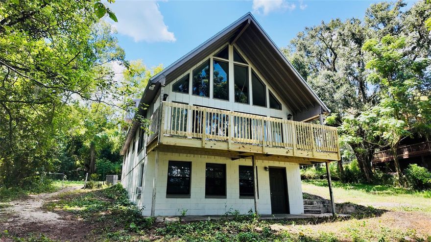 Welcome to this stunning Ranch-style residence in the heart of Fruitland Park, Florida, fully renovated and truly move-in ready. This 3-bedroom, 2-bath home with approximately 1632 square feet combines the charm of restored original wood details with modern high-quality finishes, creating a warm, elegant, and functional environment. The property has undergone a complete renovation, including a brand-new roof, a fully updated kitchen with new cabinets, countertops, and appliances, all-new flooring throughout, and fresh paint in neutral tones that bring brightness and a contemporary feel. Upon entering, the spacious living room flows seamlessly with abundant natural light streaming through large windows. The restored wood accents highlight the classic ranch character, offering both authenticity and comfort.

A true highlight of this property is its two outdoor decks: the first, located off the main living room, is perfect for family gatherings, barbecues, or simply enjoying Florida’s outdoor lifestyle; the second, directly connected to the primary bedroom, offers a private retreat to enjoy your morning coffee, a quiet reading moment, or serene sunsets surrounded by nature. Adding even more value, the home features a renovated basement that can serve multiple purposes: a fourth bedroom for guests, a private home office, a meeting space, or even your personal game and entertainment room. This versatile area expands the home’s functionality and makes it ideal for today’s lifestyle needs.

The spacious lot with mature trees provides shade, privacy, and a natural setting that enhances the home’s charm. From the backyard, you can enjoy relaxing views toward the lake and surrounding greenery, creating your very own private oasis. The location is equally impressive: just minutes from major roadways like US-441 and US-27, offering quick access to Leesburg, The Villages, and Orlando. Outdoor enthusiasts will love being close to Lake Griffin State Park, where kayaking, fishing, and hiking are at your fingertips. Everyday conveniences, including grocery stores, restaurants, schools, and essential services, are also just a short drive away.

Altogether, this home offers not only style and functionality but also an outstanding opportunity in Florida’s dynamic real estate market. With its renovated ranch character, modern finishes, versatile basement, two outdoor decks, and prime location, this property stands out as a unique blend of comfort, lifestyle, and value. Move-in ready and waiting for its new owners, this residence is the perfect choice for those who want a turnkey home that combines modern upgrades with a peaceful, nature-inspired setting while staying close to everything.