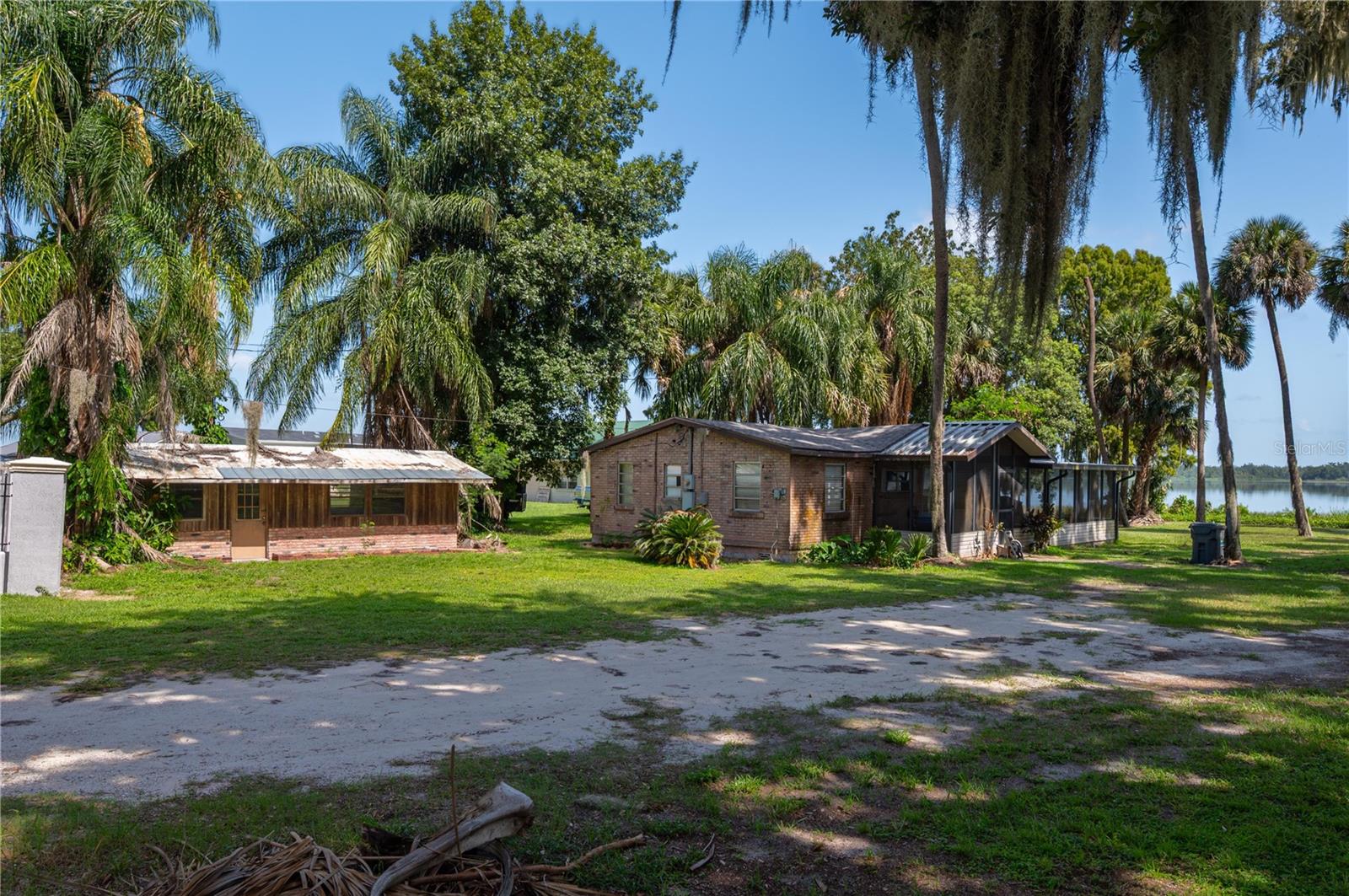 WATERFRONT PROPERTY with major potential on Lake Marion! This 2 BD/ 1 BA home situated on a 50’x180’ lot, is an excellent opportunity for an investor, a second-home buyer or a hands-on homeowner! Just a little TLC can bring this residence to its full potential for a desirable waterfront lifestyle. Relax on the big screened in porch overlooking the palm trees and shade trees that enhance the serenity of this lakefront setting, its peacefulness and spectacular lakeview. Short distance to all shopping, schools, medical facilities and restaurants; and easy travel to I-4 for airports, entertainment or visiting either of Florida’s coasts for a weekend beach trip. Call today, don't miss this great investment opportunity!