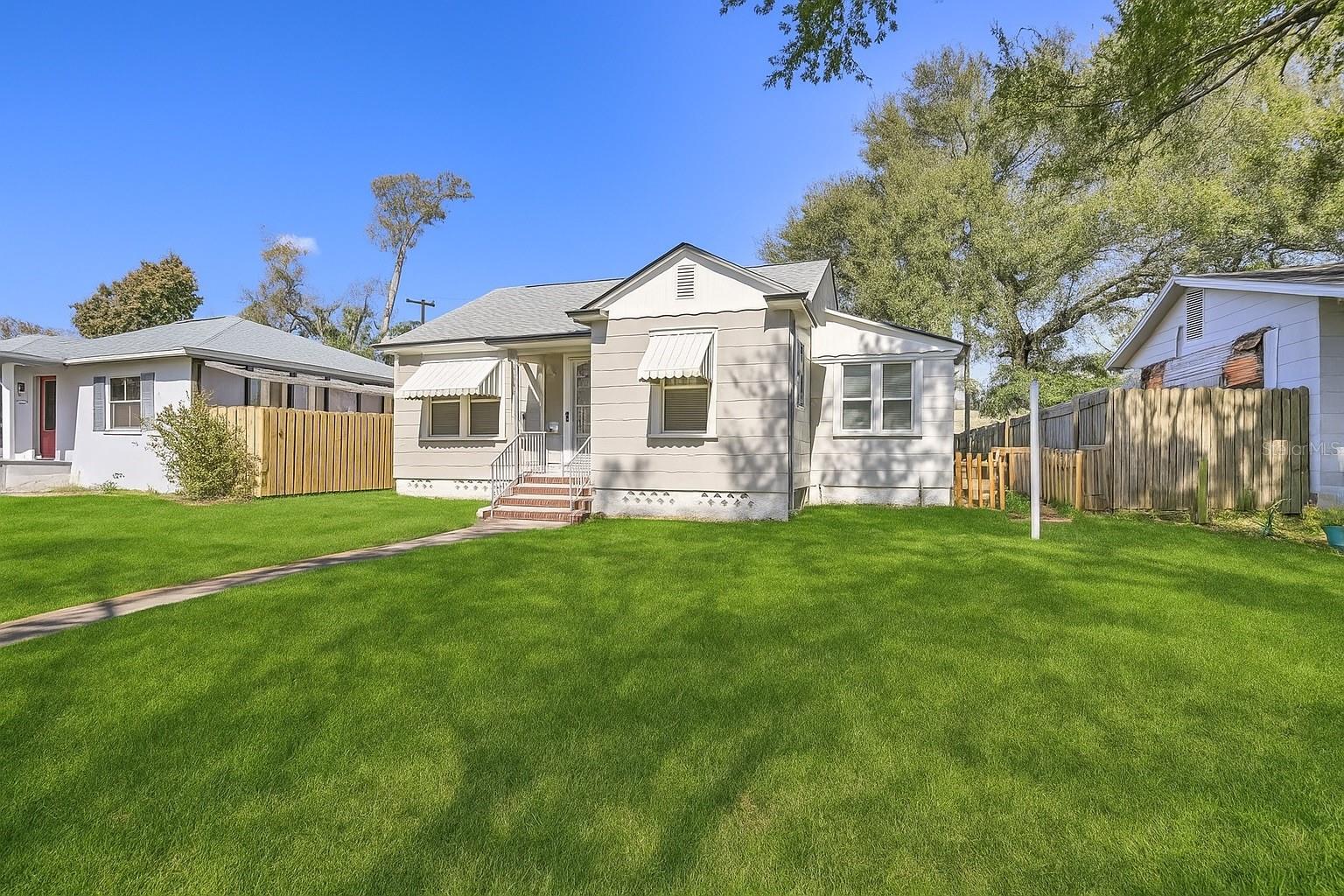 Move-in-ready property with detached in-law suite. Non-flood zone, survived many major hurricanes with zero damages or flood claims. This move-in-ready 3-bedroom 2-bathroom home consists of 2 buildings. The main house has 2 nice bedrooms, one bath, a large living room, and a bonus family or game room. The second building is an efficiency recently renovated with one bedroom, 1 bath, and a small kitchenette. Perfect to rent it for some extra income or for an Airbnb. This home was previously a 2-unit Airbnb turned into a regular rental with two units. This property is minutes from trendy and super fun Downtown St. Petersburg, museums, art galleries, Central Ave with tons of restaurants, local breweries, and live music venues. Close to beaches and boat ramps. The property has a 2-car parking pad with alley access and two street parking spots in front of the property. Both units include a stackable washer and dryer, a stove, a refrigerator, and an over-range microwave. Ready to start renting both units, move in your parents, or live in one unit, rent the second one.