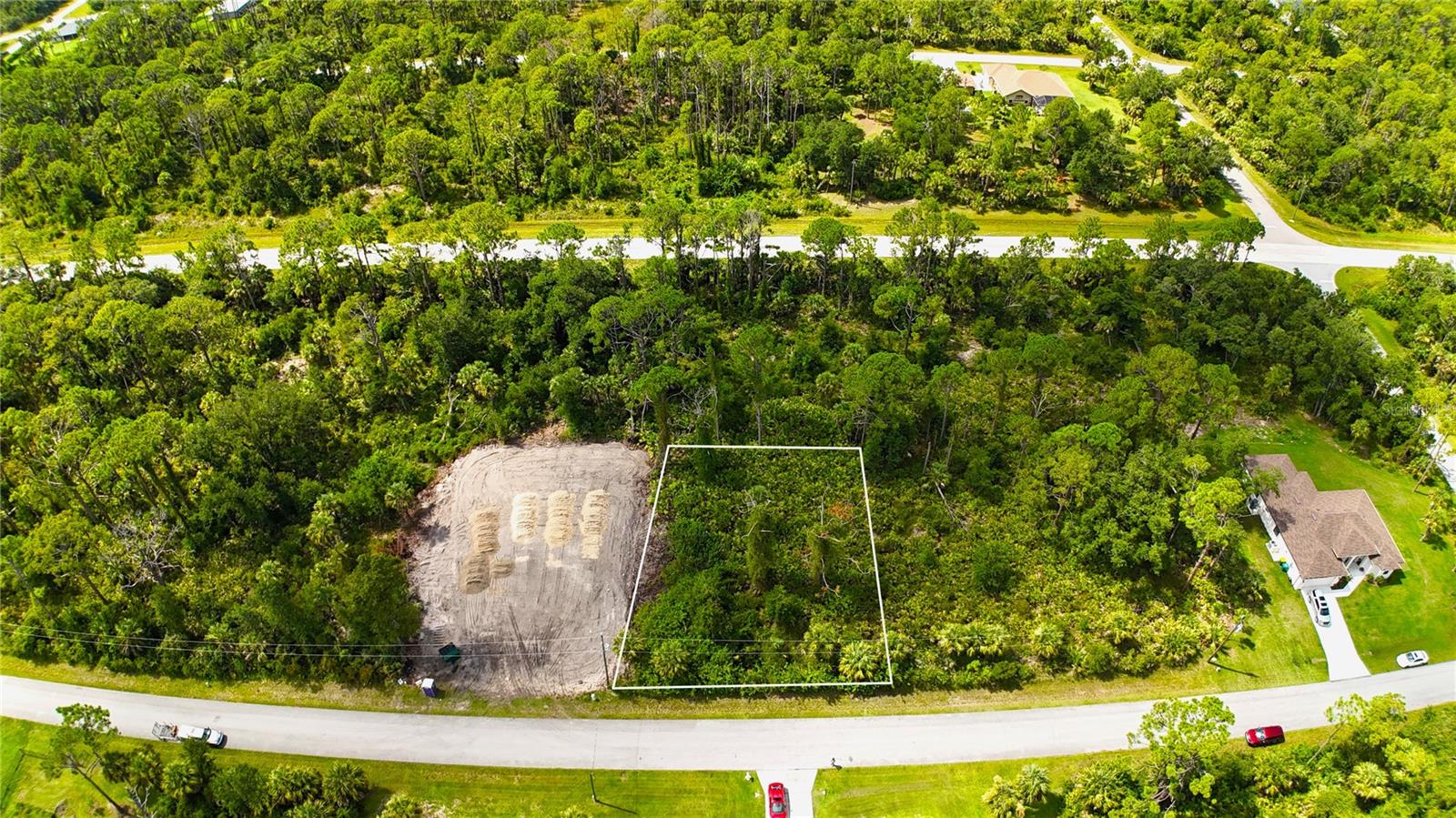 Looking for an affordable residential building lot in Southwest Florida. This lot at 14433 Racoa Ave is an excellent location in Northwest Port Charlotte where new homes are being built throughout this rural non-deed restricted area. The feel of country and yet just a short drive to beautiful Centennial Park & Charlotte Sports Park or launch your boat at Marina Park and head down the Myakka River, Charlotte Harbor and out to the Gulf. Shopping and dining in North Port is a few minutes away as well as the Murdock area of Port Charlotte. The natural resources, trails, boating, kayaking, golfing are all around you all year long. A drive to the Gulf beaches on Boca Grande, Englewood, Venice and Sarasota provide delightfulbeach days. A new home is being built right next to this lot. Great building lot with southern exposure and skilled builders available to help you design your Florida home.