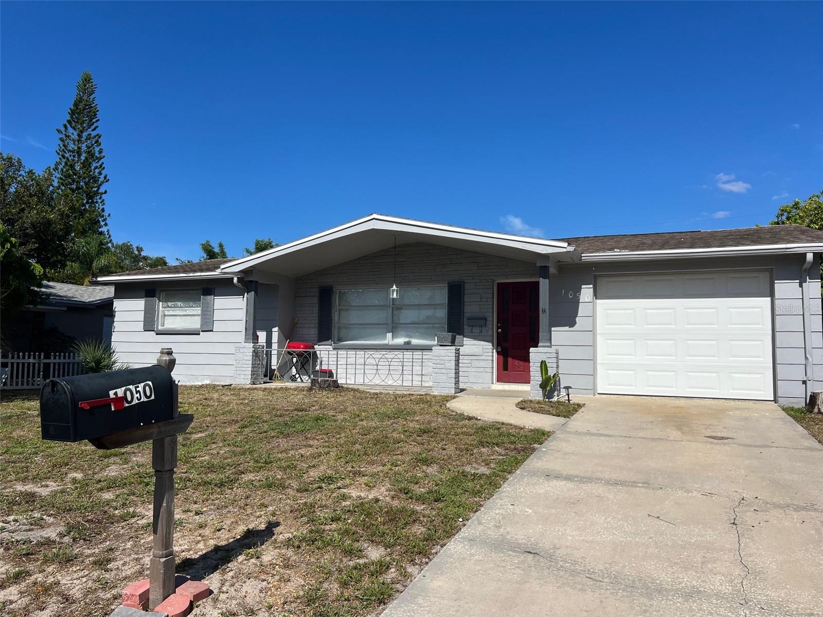 This newly remodel nice house is 1230 sqft. 2 bedrooms, 2 full baths, beautiful sun room, 1 car attached garage with remote. Washer and Dryer included, 2 refrigerators. Many upgrade, new paint, New Central air condition, New water Heater, new roof 2015, large screen in room and backyard. Located in Holiday Lake Estates nice neighborhood, Kitchen with all appliances, all electric, Breakfast Bar, newly refrigerator. The home is in good cleaning condition. It is near schools: Gulfside Elementary (assigned), Paul R. Smith Middle (assigned), Anclote High (assigned). Nearby shopping, Tarpon Springs Sponge Docks, Howard Park and Sunset Beaches. Come to see this house TODAY, It won't last longer. You can text message or call Mabel for more information.