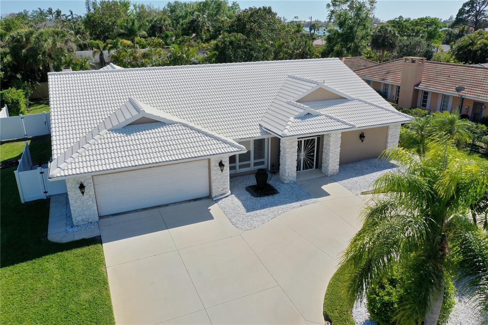 One or more photo(s) has been virtually staged. This is a MUST SEE ~ Stunning & Rarely available 3 bed/ 2 bath single family home West of the Trail in Nokomis, walking distance to the water! The curb appeal on this spectacular property is show stopping with white stone accents and circle driveway. Inside you will find high end finishes such as plantation shutters, fixtures & new floors throughout the entire home which boasts over 2,600 square feet! You are welcomed by a elegant split floor plan with a spacious living area, natural stove wood fireplace overlooking the glorious pool and patio. The nice kitchen equipped with plenty of cabinetry and sleek stainless steel appliances. The master suite is oversized with plenty of room for furniture & overlooks the pool with private slider access. The master bathroom features a luxury bathtub, his & her sinks and closets plus a large walk in shower. The other side of the home you find 2 other bedrooms, both large & nice closets. A bonus feature through slider doors is a zen cove overlooking the the pool and patio, perfect for your morning coffee. You will fall in love with the gorgeous and pristine covered back lanai & caged pool space - great to use year round in Sunny Florida. A perfect property for those looking for the serene peaceful lifestyle & living close to the bay front. Located in Blackburn Shores, a small deed-restricted community of just 19 custom homes! The community has a gated docks, picnic table and adirondack chairs overlooking the bay, just steps from your home. Plus, it's just a short distance from Nokomis Beach, Jetty Beach Park, Sorrento Golf Course, and plenty of restaurants, shopping, and entertainment. Don't miss out on this incredible annual rental!