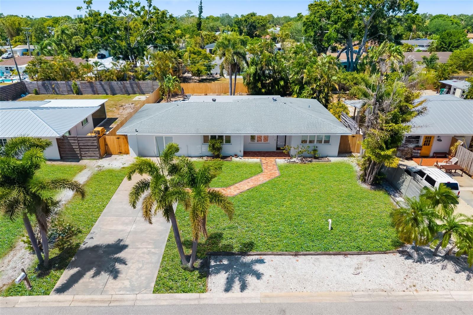 Welcome to this SOUTHGATE POOL home in the heart of Sunnyside Park—one of Sarasota’s most sought-after neighborhoods!
This beautifully maintained 3-bedroom, 2-bath residence combines classic character with modern updates, offering the ideal blend of comfort, style, and function. Inside, you’ll find a spacious layout with a brick-accented living room that adds warmth and personality. Sunlight fills the home through large windows and fully enclosed sliding doors, brightening the living and separate dining areas. The thoughtful split-bedroom design offers privacy for the primary suite, which includes an en-suite bath. A former garage has been smartly converted into a large flex room—perfect for a family lounge, game space, office, or studio.
Step outside to your private oasis. A screened lanai opens to a paved patio and open-concept pool area, perfect for soaking in Sarasota’s year-round sunshine. The fully fenced yard provides both serenity and security, while the oversized driveway offers ample parking for guests and everyday living.
Located just minutes from US41, Siesta Key Beach, and downtown Sarasota, this home is also zoned for A-rated schools like Southside Elementary and Brookside Middle. Arlington Park—with its trails, fitness center, playground, and aquatic facilities—is just a short walk or bike ride away.
Whether you're seeking walkable amenities, excellent schools, or a move-in-ready pool home in a central Sarasota location—this one checks all the boxes. Don’t miss your chance to live the ultimate Florida lifestyle.