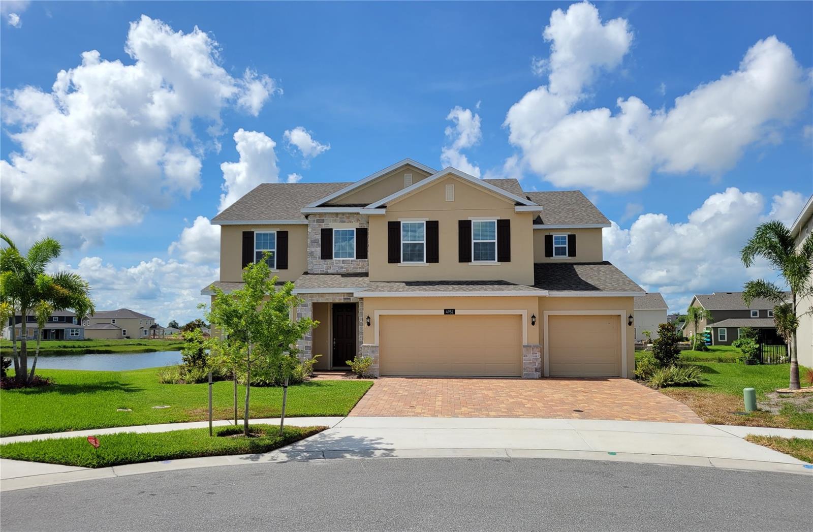 HUGE WATER FRONT 5 bedroom+ home. Very well cared for with 5
bedrooms and 2 bonus rooms, Floor plans on demand. Elegant home with Stone décor at the entry, paved driveway and 3 car garage. Enter the
wide foyer, with open office/living to the left, straight ahead past the half bath to the oversized Great room with 2 story ceilings and 2nd floor
iron designer railings on 3 sides for a great architectural view and home openness. Nice wide kitchen with dark Charcoal grey cabinets accented
thin colorful tiled backsplash, small crown and light Stone counters. Beautiful stone island countertop wrapped down the sides with sink center
and breakfast bar. Closet pantry and the fridge will be installed. The kitchen opens wide to the Great room and also to the side dining area in
back. The dining area has incredible window views of the water, or patio slider door. Two more patio sliders enter the patio from the great room.
The large patio is covered with water view from every angle. Back yard is huge with about 155 feet of water frontage and right on the corner of
the canal intersections for the best incredible views and in winter, as the sun sets lower, you can enjoy both sunrise and sunsets. Master
bedroom view also faces the water, with 2 separate walk in closets, huge bath, separate vanities and sinks, grand entry design tub with walk-in
shower behind, dual shower heads and digitally controlled water-temp. The upstairs has another huge area for entertaining in its loft family
room, laundry room upstairs for your washer and dryer and 4 more bedrooms. 2 have walk in closets, and share a jack-n-jill bath. Both this bath
and hall bath have double sinks in front with separate rooms for toilet and bath/showers for much greater convenience. Hanover Lakes is a nice
quiet gated community with its own boat launch and dock, play field, covered playground, and resort-style pool with splash pad tower, zero
depth walk-in, overlooks the canal, with a spacious sun deck and covered cabana. The canal is walk over feature that connects it to the Alligator
chain-o-lakes for unlimited adventures.
