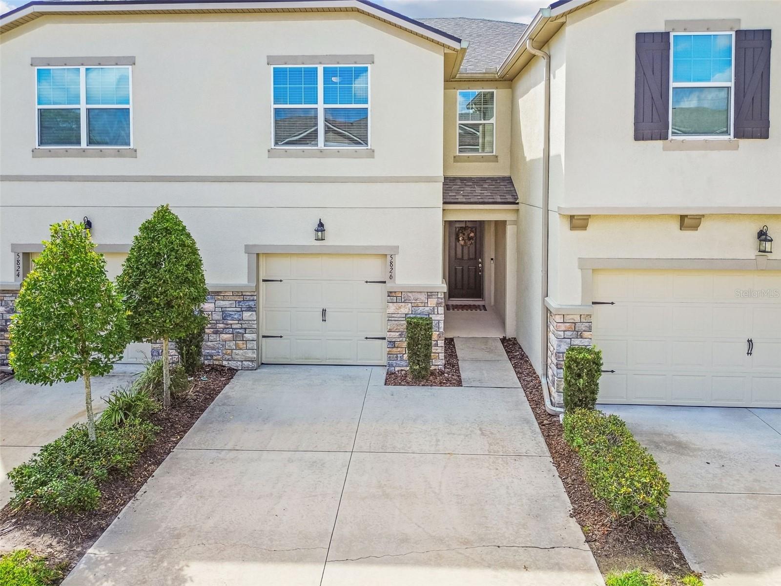 Welcome home to this beautiful townhome in the gated community of Avea Pointe in one of Hillsborough County’s most desirable areas! This move-in ready townhome offers a 3 bedroom with sizable loft, 2.5 bathroom, 1 car garage with an extended driveway, and WATER VIEWS. Built in 2020 by Mattamy Homes, this home offers low maintenance living. Come inside to a breathtaking yet modern cozy design that is light and bright. Open floor plan leads you to the heart of the home to include the kitchen and living space. The kitchen has been elegantly designed with 42 inch cabinets and trim detail, stainless steel appliances, a neutral tile backsplash, sparkling quartz countertops, and tons of storage. There is extra space for a coffee bar. Spacious center island provides additional seating and allows for easy conversation. There is space for a dining room table as well. Living area has high ceilings, luxury vinyl flooring throughout the main floor for durability and style, and serene views of the outside. 1/2 bath for convenience. Upstairs, a large loft offers flexible space for a media room, home office, or play area. The primary retreat is situated on one end of the upstairs for privacy. Beautiful bathroom with tiled walk in shower and glass enclosure, dual quartz vanities, and ample storage. There are two closets for convenience, one being a spacious walk-in. The primary space is the perfect spot to relax. Down the hallway are 2 large bedrooms with generous closet space that share a full bathroom. Storage closets throughout this amazing floor plan provide extra space. The screened in back porch overlooking the water is complete with sun shades for year round comfort. The backyard space is stunning and the local wildlife is everywhere. Residents of Avea Pointe enjoy resort-like style amenities including a community swimming pool with an inviting deck area, grill area, and play park. Easy access to the Veterans Expressway for travel to Tampa and the International Airport. Zoned for A+ schools which are nearby, hospital, grocery stores, restaurants, high-end shopping/outlet mall, and entertainment are all at your fingertips. Make sure to view the guided video.