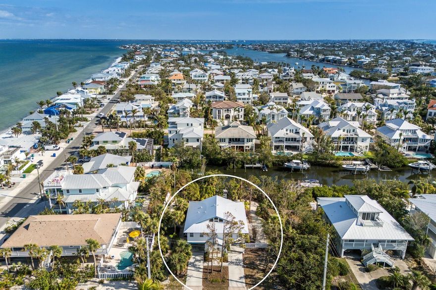 Tucked away along a tranquil canal in the heart of Anna Maria, this exceptional 3-bedroom, 2-bathroom waterfront retreat offers the perfect blend of coastal elegance and island convenience. Being sold turnkey with a strong rental history and bookings in place, this property is an ideal investment opportunity or full-time residence. Designed for effortless indoor-outdoor living, the spacious 1,900+ square foot interior features an open-concept layout, a fully equipped kitchen, and inviting living spaces filled with natural light. The primary suite provides a private escape with an ensuite bath, while the additional bedrooms offer plenty of space for family and guests. Step outside to your personal oasis, where a heated pool overlooks the tranquil canal, and a private dock provides easy access to Tampa Bay and the Gulf—perfect for boaters and water enthusiasts alike. A two-car garage offers ample storage for beach gear and golf carts, while the property’s zoning allows for rentals of any duration, maximizing its income potential. Just moments from white sandy beaches, Pine Avenue’s charming boutiques, and renowned dining, this is a wonderful opportunity to own a perfect little slice of island life!