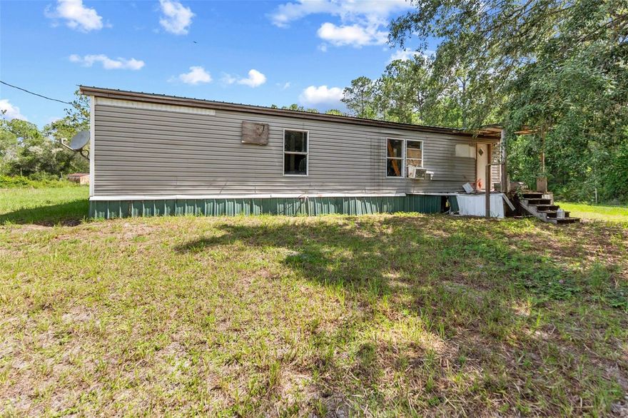 Nestled on a spacious 1.84-acre lot, this 2-bedroom, 2-bath manufactured home offers peaceful country living with plenty of room to expand. Built in 1975, the home features approximately 1,084 sq ft of living space with a functional layout and single-story design. Enjoy the quiet, rural setting surrounded by nature, perfect for those seeking privacy or a weekend retreat. The property provides ample outdoor space for gardening, recreation, or storing equipment, with no HOA restrictions. Conveniently located in Fort McCoy, offering easy access to nearby lakes, forests, and outdoor activities while still within driving distance to Ocala. A great opportunity for investors, renovators, or buyers looking to create their ideal country getaway.