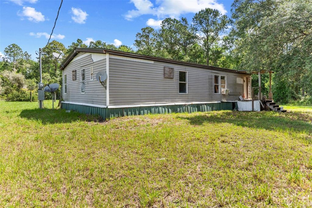 Photo of 13445 NE 156th Lane, Fort Mccoy, FL 32134 (MLS # TB8509674)
