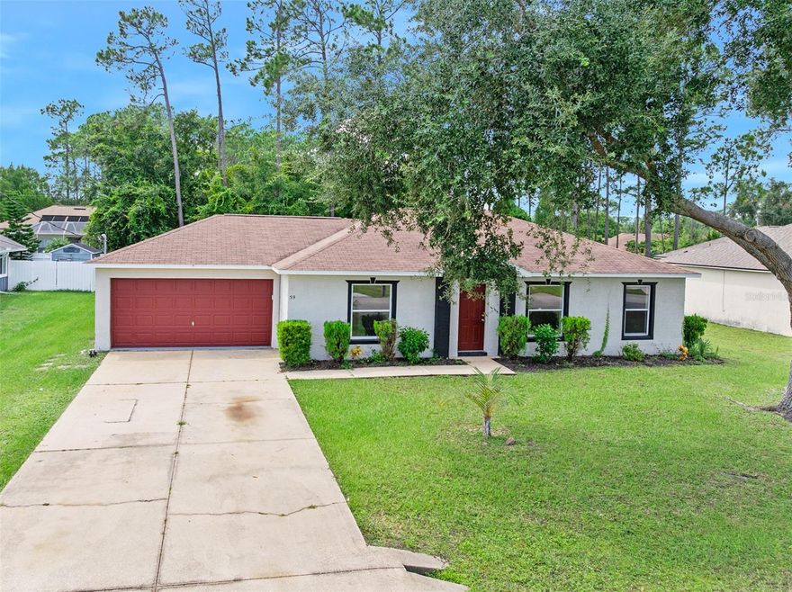SELLER TO INSTALL NEW ROOF PRIOR TO CLOSING WITH ACCEPTED OFFER!!    This charming 3 bedroom, 2 bath home is perfect for first-time home buyers or investors wanting to add a rental to the portfolio. Newly remodeled kitchen with sleek stainless steel appliances and plenty of storage. Tile flooring thought out for a clean, modern look and easier cleanup. Ceiling fans in all bedrooms and the living room, ensuring year-round comfort. An inside laundry room is generously sized. Two-car garage providing ample space for vehicles and extra storage. In a great location, Palm Coast is an expansive city with shopping, restaurants, medical, and more nearby. Don't miss out on this opportunity to make it yours!