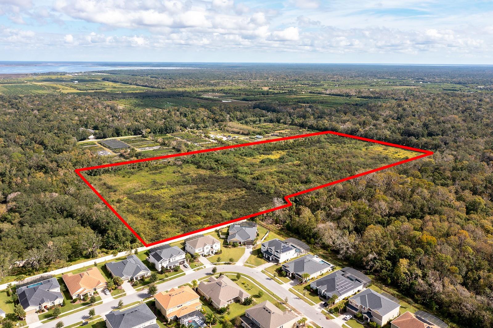 Opportunity awaits you with this incredible property which may be purchased with the adjoining properties which would make up ±46.89 acres, all zoned A-5, with an R-1 zoned neighborhood along part of the southern border and ingress/egress from both Lake Charm Dr as well as Florida Ave. ±22 acres is mostly clear, raw land with Artesian wells feeding the property; This parcel is part of Transition Area Number 1, within the City of Oviedo and Seminole County Joint Planning Area, also known as the Future Oviedo Annexation Area. To the south, the community, Retreat at Lake Charm, borders this group of parcels and features an R-1 zoning while residing within the City of Oviedo. This helps the subject property to meet one of the primary planning elements when considered for annexation into the City of Oviedo, and potential for increased density. Oviedo has shown exceptional growth and has been named as "Best Suburb to Raise a Family in the Orlando Area" by Niche.com 2020 and “50 Best Places to Live in America” by Money.com, 2020. This city, of approximately 40,000 residents, has a median age of 36 and household incomes that are some of the highest in Central Florida. The area also boasts an exceptional educational system with A-Rated schools in addition to numerous recreational amenities just steps away.
