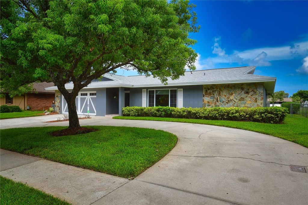 Photo of 6690 Burning Tree Drive, Seminole, FL 33777 (MLS # TB8470201)