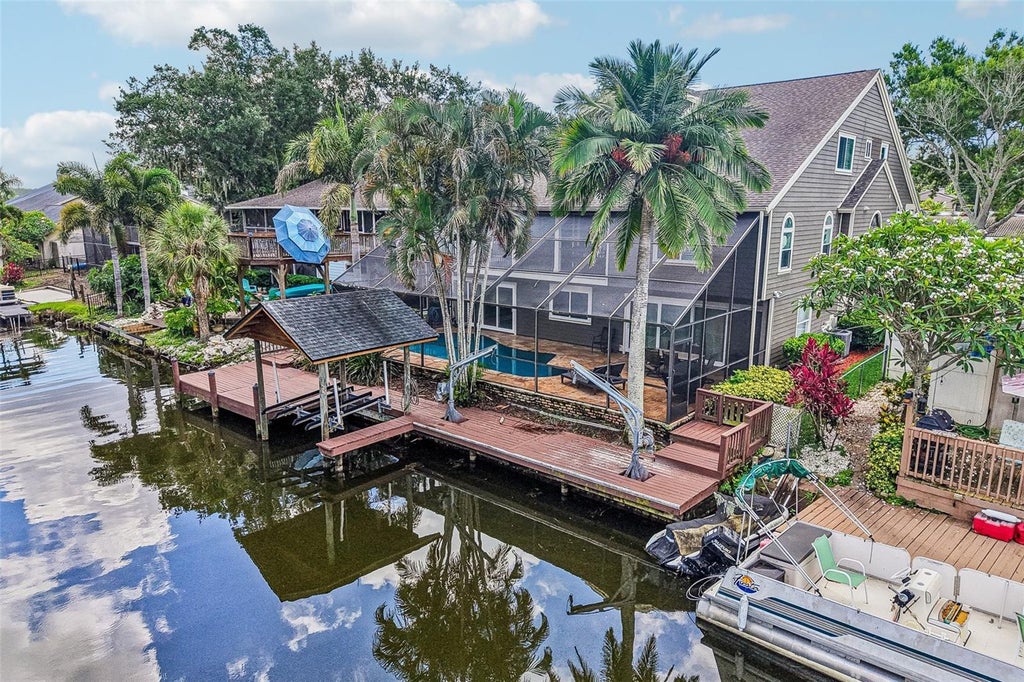 Photo of 3157 N Canal Drive, Palm Harbor, FL 34684 (MLS # TB8553882)