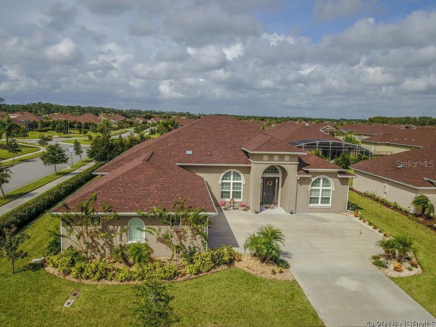 You'll love this gorgeous, single family home located in New Smyrna Beach inside Promenade Parks Community. This 3-Bedroom, 3-Bathroom 3- car garage, corner lot home will give you 2800+ sq. ft. of generous space to move about. Wake up each beautiful morning to amazing sunrises and glimmering sunlight that travels throughout the home. Enjoy a mornings breakfast in the exquisite kitchen featuring: custom ceiling lighting, hanging pendant lights over the island bar, and plenty of marvelous granite counter top space overlooking the charming living room. Enjoy a family dinner in the beautiful dining room with oversized windows and views of the elegant landscaping outdoors. Captivating hardwood flooring, elegant tile flooring, luscious carpeting, and vaulted ceilings emanates throughout the home surely brings that wonderful touch. Enter in the master suite that offers immense amount of living space with high tray ceilings, and sufficient amount of windows. Unwind in the spectacular private bath, with a delightful spa, separate shower, and his and her sink. Cookout at your very own outdoors grill and private gazebo with plenty of backyard space for some fun in the sun! The community offers a beautiful lagoon style pool perfect to cool off and relax by. South of Daytona Beach and close to Cape Canaveral you won't want to miss this amazing opportunity! Also, conveniently located near local and state parks, beaches, all major roads, and highways. Call us now to schedule your private showing today! 5K IN CLOSING COST ASSISTANCE ;Water: City