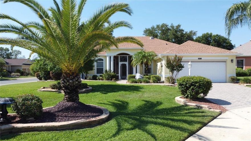 Sellers' HOT list: (What sellers love about this  home)  "Great for entertaining (private guest suite), Florida Room with wall of windows is heated and cooled, brick paver patio for grillin" and chillin" is nestled in the private backyard, professionallly landscaped and professionally cared for Florida landscaping,  and of course their neighbors!"  The interior has been transformed into a light and bright updated paradise with crown molding throughout, soft neutral wall paint, light luxury vinyl plank flooring through out (except in tiled bathrooms and bedrooms), white kitchen cabinetry, updated light fixtures, new window covering and cornices. Floor plan includes two master bedrooms with direct access to the Florida Room, Den (currently the third bedroom) Livingroom currently used as music room/office, dining room, family room, breakfast nook, kitchen with white cabinetry and updated appliances, granite counter tops, tile backsplash,and breakfast bar. Utility room with washer, dryer, utility sink, upper cabinets. Master bathroom has dual sinks, walk-in closet and tile floor. 2nd master bathroom has walk in shower with glass block wall and 2 closets, one being a walk in, 2 garage has been extended by 4 feet, has pull down stairs for storage above garage and a motorized garage door screen. This home oozes curb appeal with professionally landscaped corner cul de sac lot Florida landscape includes giant palm tree, bird of paradise,ruby red flowering crepe myrtle all enhanced with a brick paver drive way, stacked stone landscaping edging and  brick walk way to home.  Additional updates include Roof-2023,HVAC 2021,exterior paint 2023.Enjoy the retirement lifestyle that the Plantation at Leesburg affords 18 hole golf courses, 3 activity centers with heated pools,men and women softball, pickleball, boccee ball, shuffleboard, horseshoes,rv parking,woodworking shop,cards, games, dances.Drive thru this community and be awed by the lush landscaping and abundance of trees.  The Manor, the main club house looks just like Tara Plantation. Leesburg is located in the middle of the state, fastest growing city and safest place from a hurricane. Close ot Orlando Parks and either coast is 1 hour away.