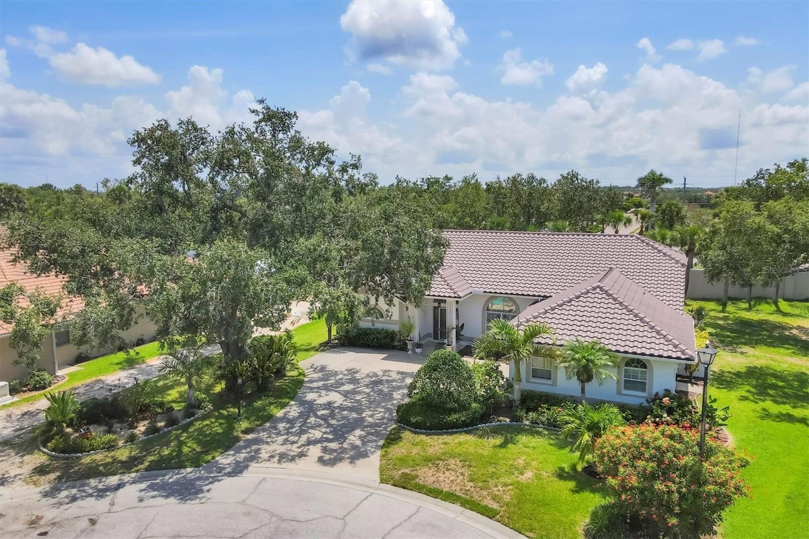 HUGE PRICE ADJUSTMENT!!!
Tucked into a quiet cul-de-sac in the gated Hidden Lakes Club community, this stunning home offers a rare combination of privacy, space, and Florida charm. Situated on an expansive 0.46-acre lot, the property is surrounded by lush landscaping and mature trees, creating a peaceful backyard retreat that feels like your own private sanctuary.
Inside, you’ll find 2,252 square feet under air, a flowing open floor plan, and soaring ceilings with two skylights that make the space feel bright and airy. The home features three oversized bedrooms, each with generous storage—walk-in closets in both guest rooms and two in the primary suite. The primary bath includes dual sinks with a vanity, a soaking tub, and a walk-in shower. The second bath doubles as a pool bath, ideal for outdoor living.
With four sets of sliders leading out to the lanai, this home was designed for seamless indoor-outdoor living. Enjoy your morning coffee or entertain guests by the pool, surrounded by the privacy and natural beauty that only a lot this size can offer. The lanai is spacious, the pool heater is brand new, and there’s plenty of room for outdoor dining and lounging.
Other highlights include a brand-new roof, low HOA fees, no CDD fees, a separate laundry room with built-in office space, and an oversized two-car garage with extra room for storage or hobbies. Plus, the home is not in a flood zone—a huge bonus for peace of mind.
If you’ve been searching for a well-maintained home with space to breathe, in a quiet and beautifully kept neighborhood, this is the one. Schedule your private showing today and come experience everything 188 Grand Oak Circle has to offer.