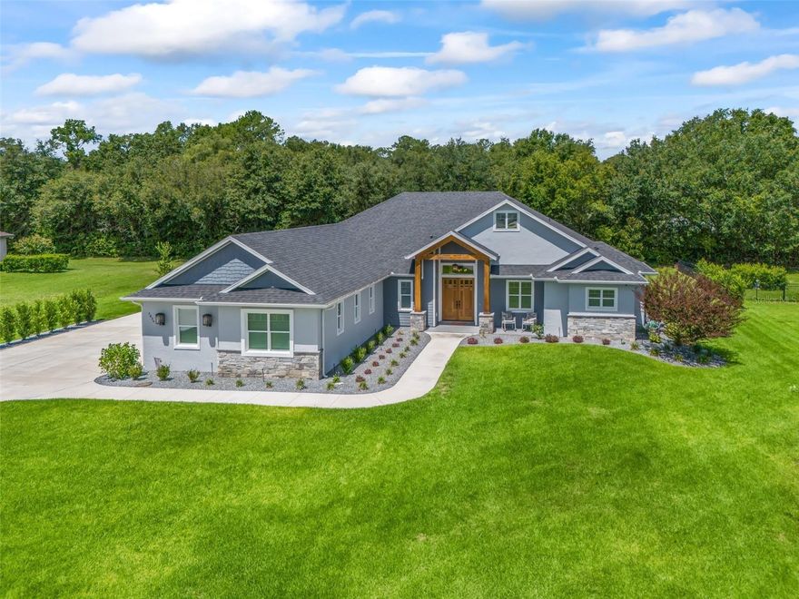 Welcome to Legendary Trails — where modern comfort meets Florida living at its finest! Like New - Built in 2021, this stunning 4-bedroom, 3-bath home offers the perfect blend of style, space, and functionality. Step inside to discover a bright, open-concept layout designed for both everyday living and effortless entertaining. The spacious kitchen is a beauty, with quartz counters, stainless appliances and generous walk-in pantry, creating a warm and inviting atmosphere for family and guests alike. The thoughtfully designed tri-split floor plan provides privacy for the primary suite, featuring a spa-like bath and generous closet space. Three additional bedrooms and two full baths offer flexibility for guests, a home office, or growing families. The additional front room can function as a study or formal living room.  Closets/Storage galore throughout the home.   Outside, your private backyard oasis awaits! Enjoy year-round relaxation in the screen-enclosed pool — perfect for soaking up the Florida sunshine without the bugs. Whether hosting summer gatherings or enjoying a quiet evening swim, this space is sure to impress. The 3-car garage provides ample room for vehicles, storage, or even a workshop area.  Convenient to the Santos biking/walking trails. Additional perks: whole house generator, 1000 gallon propane tank, Upgraded woodwork detail incl all cased windows, single-cell insulation & irrigation well to keep those utility bills down!  
Located in the highly desirable and gated Legendary Trails community, this move-in-ready home combines newer construction, modern finishes, and resort-style living — all in one incredible package.