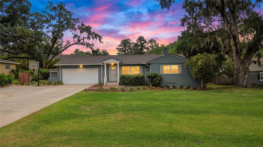 --WOODFIELDS--Welcome to the WOODFIELDS, a SE OCALA, NO HOA/ NO Deed Restrictions neighborhood, just a Golf Cart's Ride to the Downtown Ocala Square! Exuding charm and character, yet modern design features, this 4 bedroom, 2.5 bath concrete block/ brick home has been both restored and improved in recent years. Step inside on to original, refinished hardwood floors running throughout your mid-century home. Natural light pours into the living spaces, wooden blinds accompanying the 2018 windows. To your right, find 2 large guest bedrooms with ceiling fans and built-in closets; the guest bathroom with tile step-in shower just down the hall. The generously-sized primary bedroom suite measures 19x13 ft., and can easily fit a King-sized bed and more of your favorite furniture pieces. The ensuite bath offers a tub/ shower combo and a new vanity. Just beyond the living room is a dining space with charming built-ins. The kitchen, completely remodeled in 2022 with storage and functionality in mind, sits on tile with soft-close cabinetry, stainless steel appliances including gas stove, garbage disposal, granite counters, and a subway tile backsplash. Just beyond the kitchen is the family room overlooking the private backyard oasis with pool- this is the perfect spot to lounge and enjoy time together. A half bath with modern finishes, and the laundry room with storage found here. Your 4th Bedroom/ OFFICE sits just beyond the family room and boasts a huge custom walk-in closet for your essentials, and a Murphy bed for guests. The backyard has been thoughtfully designed for entertaining, yet privacy. The pool and spa were completed in 2020. The screened enclosure sits on pavers, plus a bonus 16x11 ft. covered space for grilling, relaxing, and watching your favorite team, located just off the pool. The backyard is fully fenced with custom, horizontal, wood boards. Don't miss the attached 2-car garage to store your vehicle and golf cart, plus the extra storage on the side yard. BIG TICKET UPDATES include: ROOF & Full-home windows (2018); Pool & Pool Pump, Birdcage, Pavers (2020); Kitchen Renovation (2022); HVAC & Ductwork (2023); Original Hardwoods Refinished in common areas; GAS Appliances include Stove, Hot Water Heater, Furnace, And Dryer Hookup. School Zoning includes Eighth Street Elementary, Osceola Middle School, and Forest High School. Public Utilities through the City of Ocala for Water, Electric, Sewer, Trash Pickup & Recycling. NO flood zone. Murphy Bed in 4th Bedroom and Child Safety Fence for Pool Convey with this purchase! Don't miss this 4 BEDROOM, UPDATED, POOL HOME in this SE Ocala coveted School District. Bring your golf cart and swim suit- you are just in time for Summer in the Woodfields!