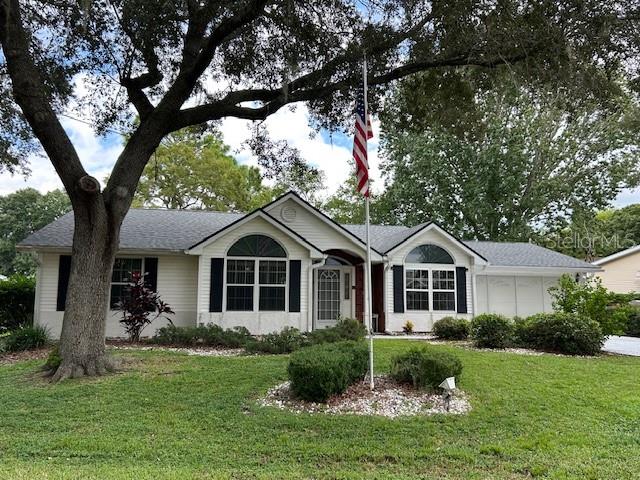 The 3/2/2 popular Providence Model home is well maintained and move-in ready! The Aquatic Center Indoor Pool is just down the road! When you enter through the welcoming front entrance, you notice the spacious living room with lots of natural light from 3 skylights in the cathedral ceiling. Off the living room is a formal dining room and kitchen that features stainless steel appliances and another skylight. The spacious lanai at the rear of the home has Glass Slider Windows, that look out on a private fenced-in backyard. French Doors lead to a Large Primary Bedroom, with Tray Ceilings, a walk-in closet, and an ensuite with walk-in shower and makeup vanity. One of the two guest bedrooms has a Murphy Bed that make it a versatile guest room, den or office. The Laundry Room, just off the kitchen leads to an attached 2 car garage, that has a utility tub and Slider Screens. The New Roof 2024, AC 2021. Oak Run is a 55+ gated community with 6 pools, 5 spas, 2 fitness centers, Library, Billiards Room, Card Room, Dog Park, Restaurant, Golf Course and Driving Range. There are plenty of clubs to join and the community is close to Medical Facilities, Shopping and Restaurants.