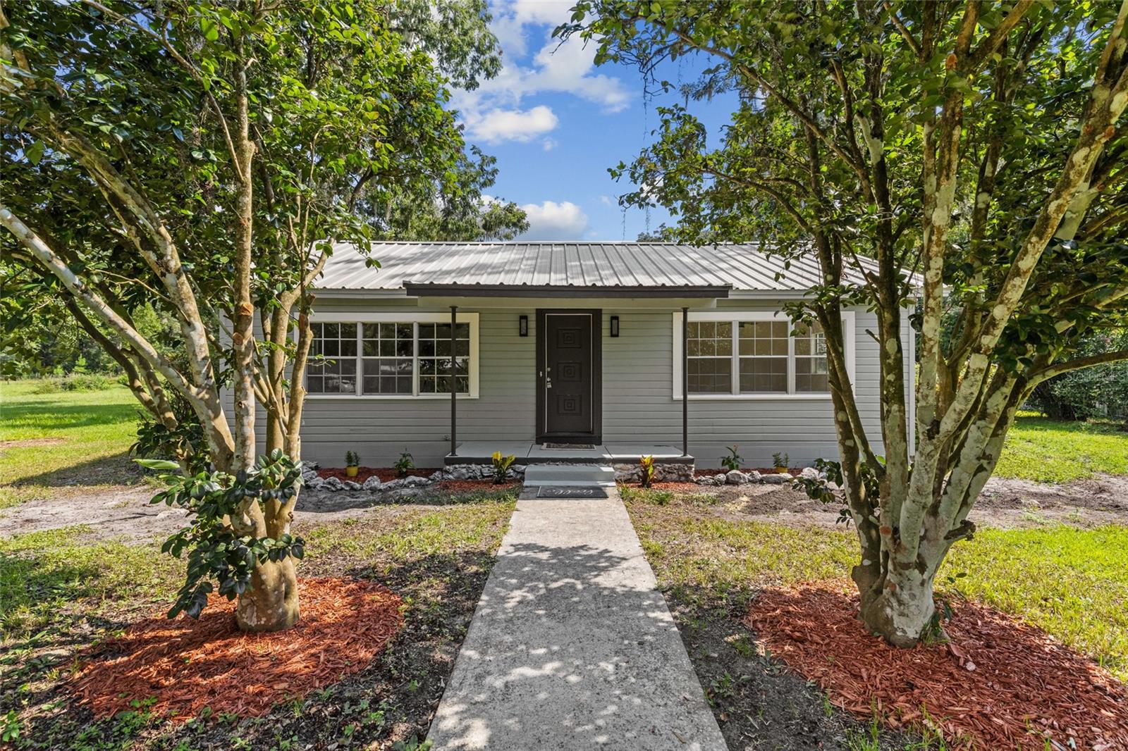 Nestled on a peaceful 1.6-acre lot, this beautifully refreshed Ranch offers modern updates and country-living convenience just minutes from Gainesville. Major recent upgrades include a durable metal roof (10 years), brand-new HVAC and plumbing repipe (both completed in 2025), and an upgraded electrical panel—ensuring worry-free comfort for years to come. Inside, you'll find a freshly renovated kitchen and bathrooms, plus all-new paint and flooring throughout. Whether you're looking for serene rural surroundings or an easy Gainesville commute, this turnkey home delivers both. Don’t miss this rare blend of quality, location, and peace.