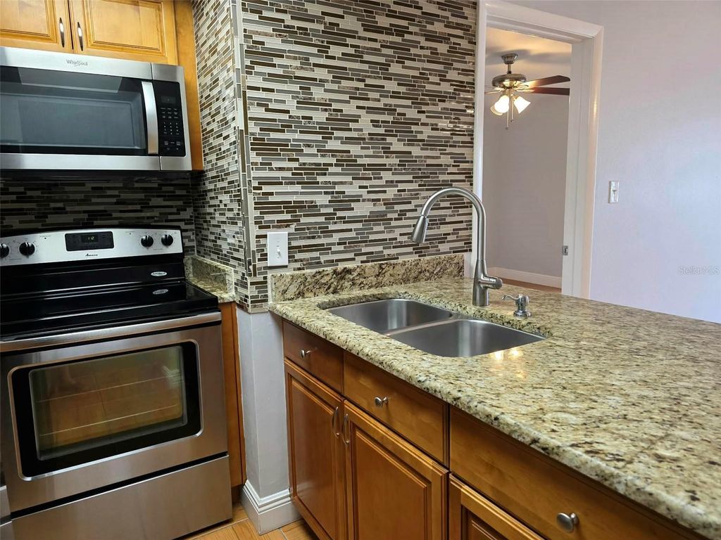 Photo of 4712 Marine Parkway #206, New Port Richey, FL 34652 (MLS # TB8479038)