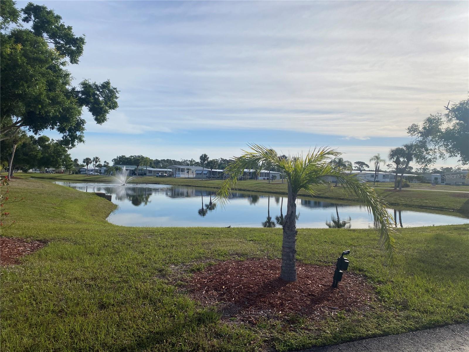 Vacant Lot. This is a prime lake corner lot on a quiet La Casa Street with beautiful view overlooking the length of Lake Encorvar. The lot is located near our Club House and amenities. La Casa is a quiet senior community, just for persons 55 and up, located in North Port, Florida in Sarasota County. There are 974 homes nestled among a variety of native trees with spacious common grounds surrounding our eight lakes. Our lots average a generous 60' by 80'. The ultimate lifestyle on Florida’s Gulf Coast is located between Sarasota and Fort Myers with boat access to the Gulf of Mexico. La Casa is an impeccably maintained isolated and self-contained oasis. It is convenient for shopping, sightseeing, golfing, fishing and boating, as well as all the culture and elegance the Southwest Florida area is noted for. Residents and visitors enjoy the warmth of Southwest Florida winters in a relaxed and unhurried environment far removed from the hustle of Florida’s east coast. You’ll be surrounded by hundreds of palms reaching for the sky and beautiful mature lush landscaping which demonstrates the utmost level of care our property receives from residents and management
La Casa may have the best pools in the area. An extremely large, 40 X 60-foot swimming pool is our crown jewel and is kept at a perfect 87 degrees. Our smaller 20 x 40 pool is quietly nestled between the clubhouse and the Activity Building. Both pools have adjacent hot tubs which are perfect for soaking muscles that are tired from golfing or tennis. Wireless Internet (WiFi) is available at the Clubhouse, Activity Building and Recreation Hall area where these pools & spas are located, so you can catch some rays while you catch up on your email! Sound enticing? La Casa is a friendly, family community. You will be away from the hustle and bustle except when you want to be part of it. When you leave our gates, North Port is only 1.5 miles from the city center, where you will find every kind of retail store and service you could need.
Come for a visit or make La Casa your home!