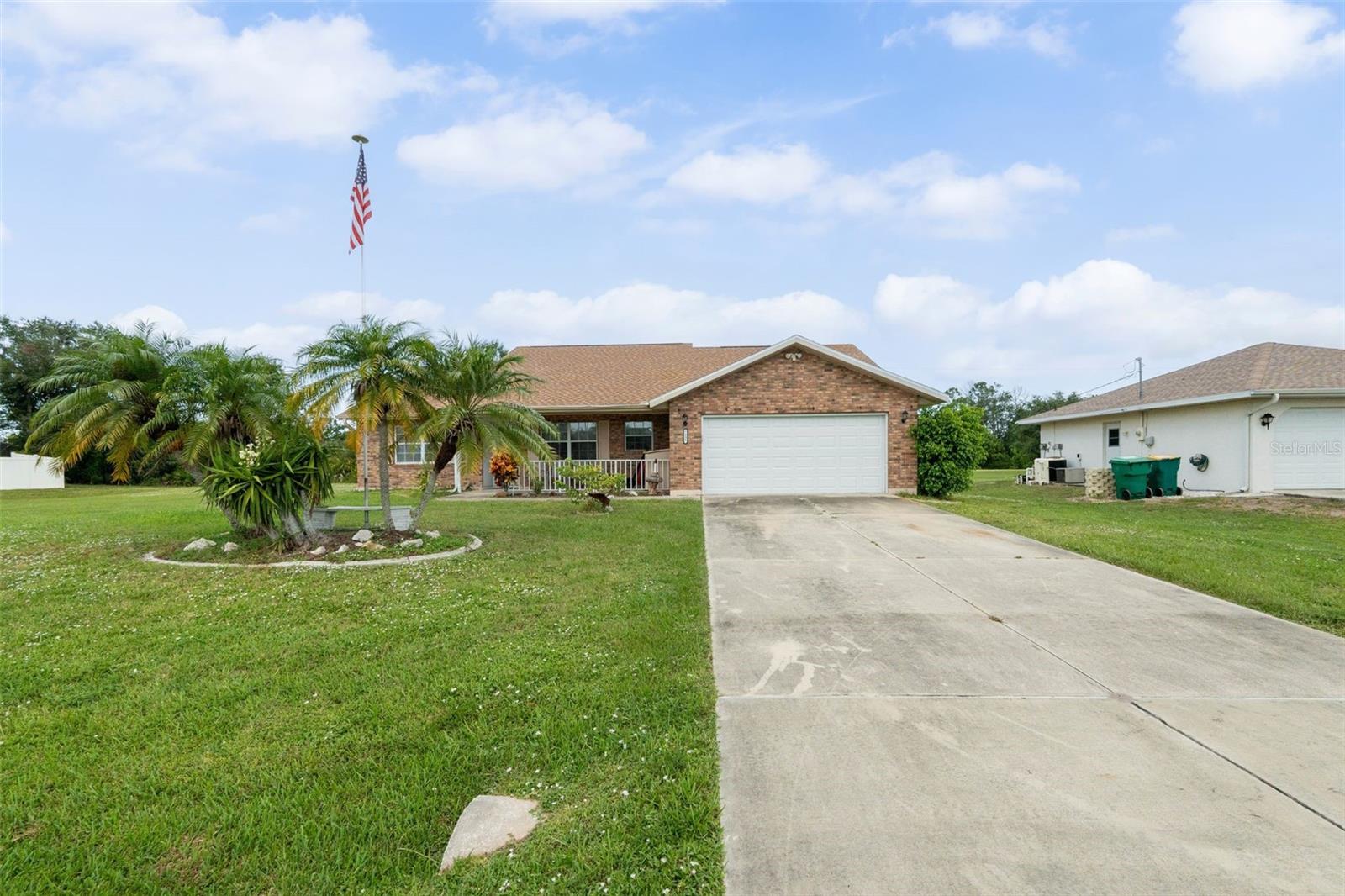 Jump on this incredible deal! Move-in-ready brick-front split-plan three bedroom pool home on an oversized lot in Englewood East, topped with a new 2023 roof and well maintained from curb to lanai. A spacious living room flows into the bright eat-in kitchen, while the generous primary suite with walk-in closet and private bath sits apart from two comfortable guest rooms. Sliders reveal a large screened lanai where a well-kept pool overlooks a tranquil greenbelt—no rear neighbors in sight. An oversized garage, indoor laundry, solid concrete-block construction, and ZERO HOA or deed restrictions add daily convenience, all just minutes to Manasota Key beaches, golf, shopping, and dining. Set up a time to see it today!