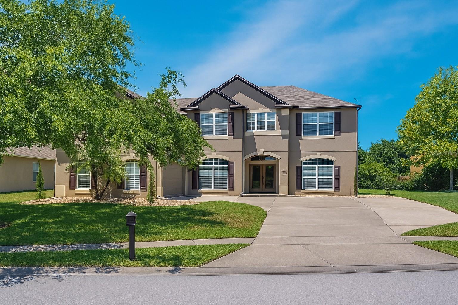 Closing cost or rate buy down provided!! Buyer also has the ability to assume the loan at a 4.375 rate! Welcome to this spacious 5-bedroom, 4-bathroom pool home in the gated lakefront community of Johns Landing! With nearly 4,000 sq ft of living space (excluding the garage), this home is perfect for large or multi-generational households. Upstairs features two primary master suites, ideal for extended family or shared living arrangements, along with additional bedrooms and a spacious loft with its own bathroom. Downstairs includes a private bedroom as an in-law style suite or guest quarters. The layout also offers formal living and dining rooms, an open kitchen with center island, and a generous family room that leads to a screened-in pool and spa with covered patio for entertaining. The roof is new, the HVAC was just serviced 8/13/2025, the pool was acid washed, and equipment is new, 8/13/2025. Note, some pictures have been digitally enhanced.
Residents enjoy gated access, a playground, and a private community boat ramp to Johns Lake, renowned for boating and fishing. Conveniently located just minutes from historic downtown Winter Garden and Downtown Clermont, few minutes to the FL Turnpike, and about 30 minutes to downtown Orlando and major attractions, this home offers the ideal combination of space, comfort, and location.