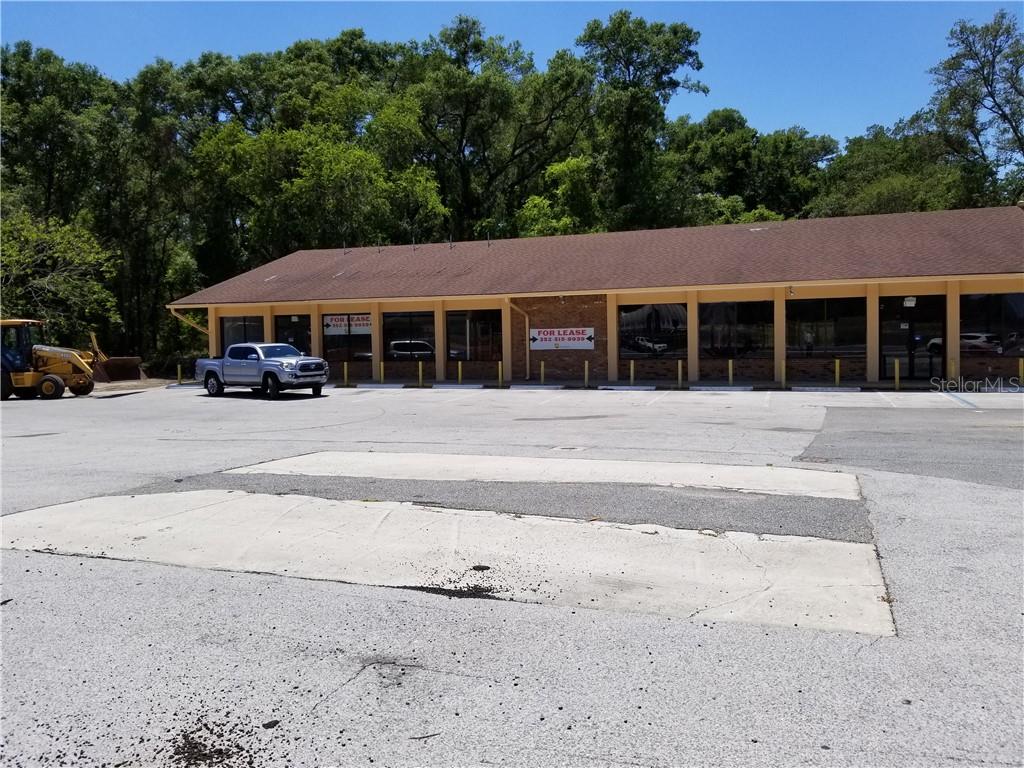 OPPORTUNITY ZONE 3.96 acres 1/2 mile from I-75 at exit 358 . 5000 sq. ft building on the site Newly Renovated ADA Compliant Rest Rooms .Aprox 3 acres Fenced and gated, Partially Cleared . ZONED B-5 with Many permitted uses , Property is located at High traffic intersection , 600' of road frontage.