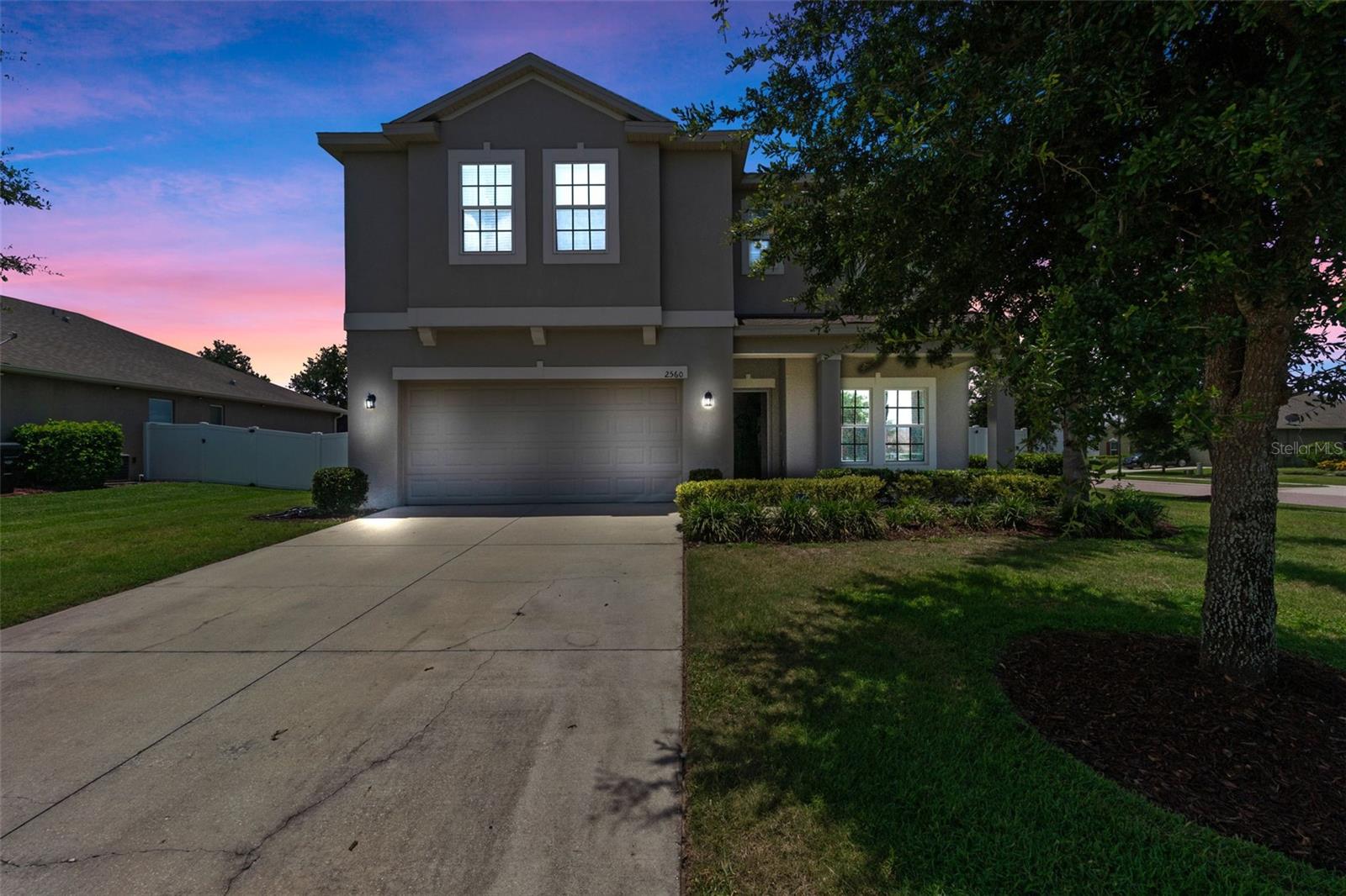 Welcome to this beautiful 5-bedroom, 3-bathroom home nestled in the gated community of Clear Lake Landings! Built in 2019, this spacious residence offers over 2,500 sq ft of thoughtfully designed living space, perfect for families or anyone seeking comfort and versatility.
Step inside to find a bright open-concept floor plan featuring a formal dining area, a large kitchen with granite countertops, 42" cabinets, stainless steel appliances, and a convenient pantry. The kitchen overlooks a cozy breakfast nook and inviting family room — ideal for gatherings and everyday living.
Downstairs includes a private guest suite with a full bath, while upstairs you’ll find a generous loft, spacious secondary bedrooms, and a relaxing owner’s suite with a huge walk-in closet and a beautifully appointed en-suite bath.
Smart home upgrades include Nest thermostats. Enjoy Florida evenings on your covered back porch overlooking a fenced corner lot — perfect for pets or play!
Clear Lake Landings is a quiet, gated community offering green spaces, a picnic pavilion, playground, and sidewalks — all with low HOA fees. Conveniently located near major highways, schools, shopping, and beautiful Lake Apopka trails, you’ll have quick access to everything you need.
Don’t miss this move-in ready gem — schedule your private tour today and experience the best of Apopka living!