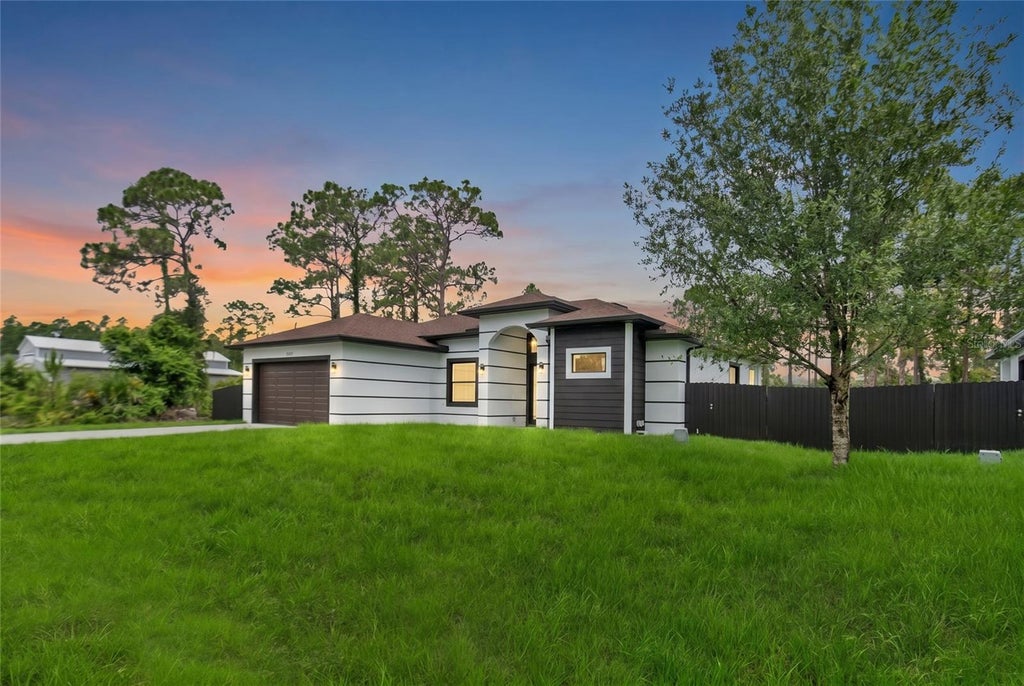 Photo of 1047 Merry Street E, Lehigh Acres, FL 33974 (MLS # A4703349)