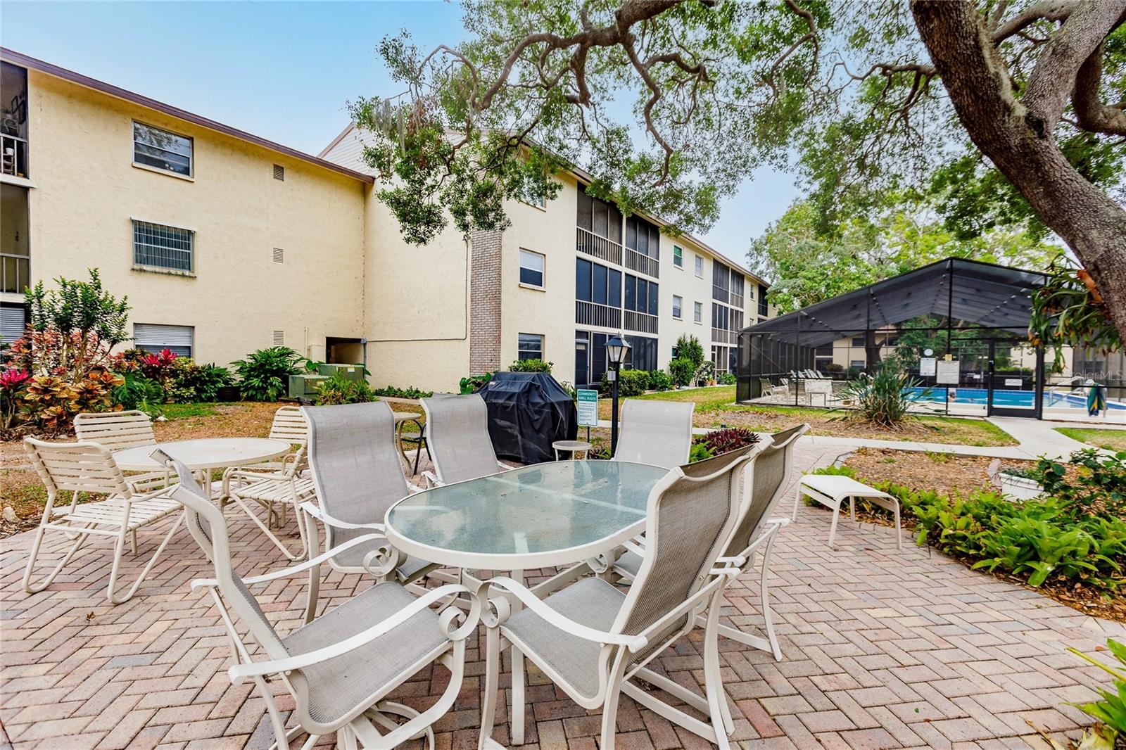 Welcome to Tregate Manor! This ground floor two bedroom two bath home needs nothing and is ready for a quick move in. Located under a mile from Crescent Beach you can live a vacation lifestyle in an affordable condo. This kitchen is well appointed and opens right up to the dinning and living room. Plantation shutters throughout for charm and privacy. The primary bedroom is generously sized with a large walk in closet. Second bedroom offers built in cabinets for additional storage. The lanai is situated over looking a beautiful landscaped seating and pool, it is perfect for your morning coffee or evening cocktails. This 55+ community is the perfect place for your retirement or winter retreat. Enjoy a dip in the large covered pool or socializing in the lush courtyard with neighbors. You are sure to make plenty of new friends in the community with plenty of group outings and get-togethers. Low HOA fees in a stable association that include your cable, trash, water. There is even a private gate so you can walk to Publix, shopping and restaurants. Everything the vibrant city of Sarasota has to offer is close by and waiting for you to enjoy!