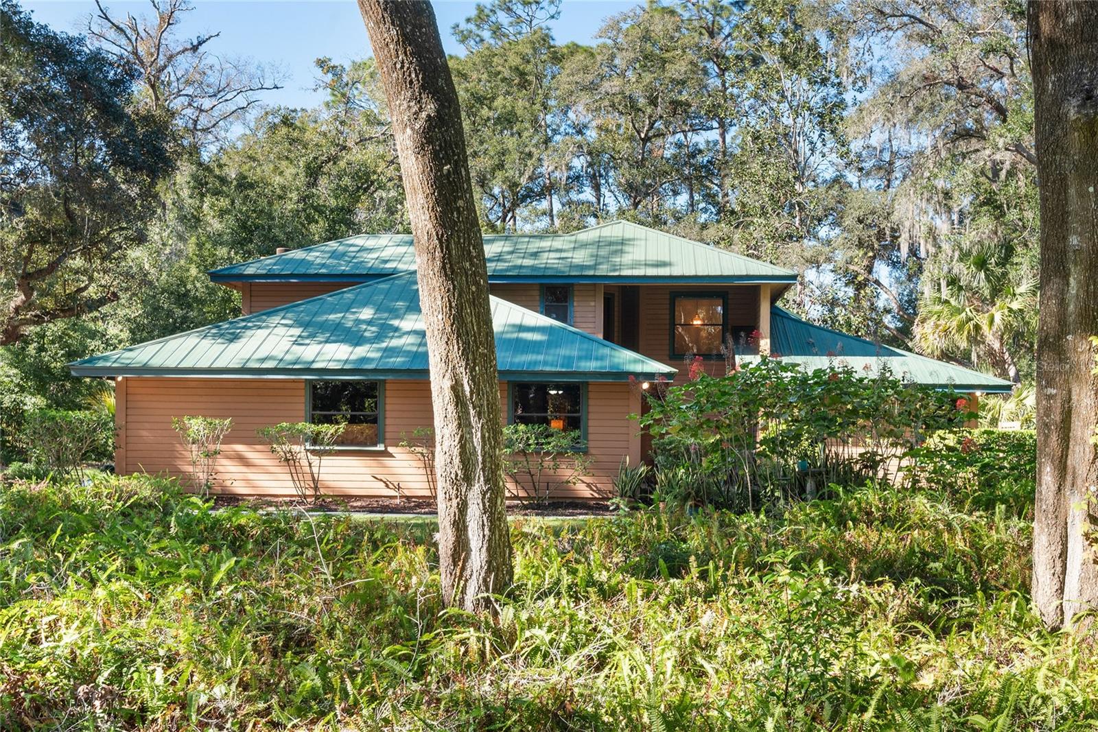 Escape to your private retreat in Seminole County, “Florida's Natural Choice.” This isn't just a house; it's a sprawling 1.02-acre wooded sanctuary, perfectly positioned near the untouched beauty of Florida's parks, forests, and pristine lakes. Imagine the possibilities in this spacious five-bedroom (with potential for a sixth), three-bathroom residence, ideally situated in the highly sought-after Markham Corridor. Step inside this impressive 3,375 sq ft home and be captivated by stunning slate and wood floors, soaring vaulted ceilings, and an expansive great room – all complemented by the convenience of a downstairs primary suite. Outside, your private oasis awaits! Dive into the sparkling pool, unwind in your secluded backyard, or enjoy tranquil moments on the upstairs deck. The generous 1.02-acre lot also provides unparalleled flexibility for future expansions, a guest house, or even a workshop – truly making it your own. This isn't just a home; it's a smart investment in a rapidly appreciating area. Secure immediate equity in a neighborhood where comparable properties are commanding significantly higher prices, giving you the freedom to truly create your dream home. The community HOA for the common area at the community entrance is voluntary. This home comes with both an American Home Shield home warranty and a transferable termite warranty for the new owner. Its prime location offers unbeatable access to the 429 Beltway, kayaking adventures on the Wekiva River, and the vibrant downtowns of Sanford, Heathrow, and Lake Mary – putting convenience and recreation at your fingertips. Don't miss this rare opportunity to transform this house into your ultimate sanctuary!