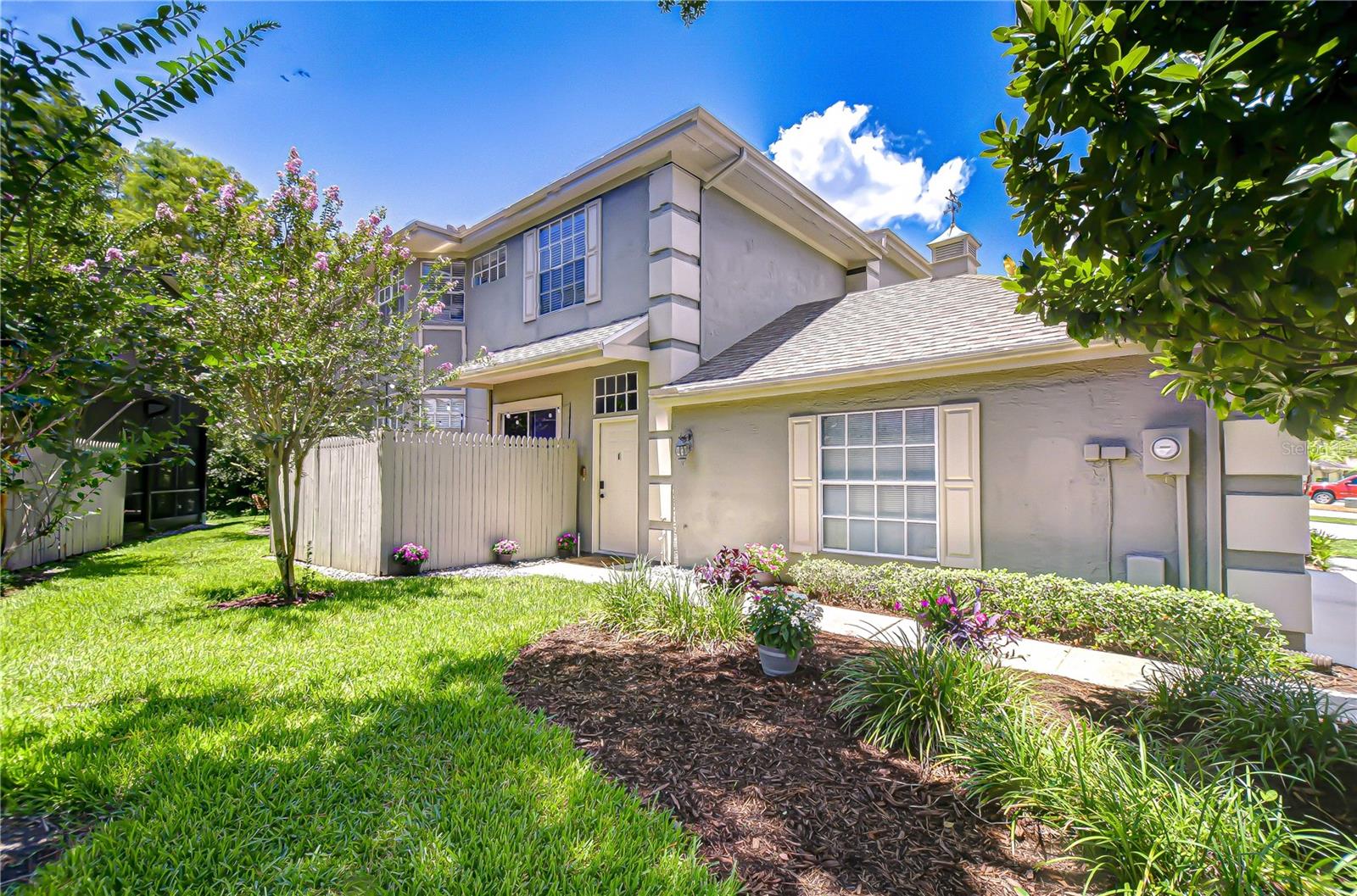 CARROLLWOOD VILLAGE GEM! Light and bright END UNIT 2 bedroom/2.5 bath/1-car garage townhome with PRIVATE CONSERVATION VIEWS in the coveted community of CHARDONNAY. This home has been lovingly cared for by the owners. Updates include NEW ROOF 2025; NEW A/C 2024; NEW INTERIOR PAINT on first level and up the stairs 2025; NEW low-flow high toilets in primary and downstairs half bath 2025; Stainless Steel French Door refrigerator 2023; newer light fixtures throughout, remote fan and light for second bedroom; custom slider window shades; RING doorbell; SMART thermostat. Additional features include expanded quartz countertop in kitchen with bar seating; remodeled half bath; granite countertops in both upstairs bathrooms, laminate flooring throughout living areas and primary bedroom. Laundry closet is conveniently located upstairs between the two bedrooms. The primary bedroom has a spacious private bath with dual sinks, garden tub, shower and oversized walk-in closet. The extra large second bedroom with vaulted ceiling has an ensuite bath with dual sinks and tub/shower, and can also be accessed from the hallway. THREE OPTIONS FOR OUTDOOR LIVING SPACE: private side patio perfect for lounging and grilling, back covered deck off family room and second floor balcony off primary bedroom where you can relax and enjoy beautiful sunsets along with the sights and sounds of nature. PARKING FOR THREE VEHICLES (single garage and two driveway spaces). Chardonnay monthly HOA of $172 includes community pool with new patio furniture, grounds and driveway maintenance, exterior painting and private roads. Carrollwood Village Master HOA is paid annually ($670.46) and amenities include playgrounds, tennis, pickleball and basketball courts and scenic picnic area along with miles of sidewalk for walking, jogging and biking. Nearby Carrollwood Park features walking paths, large pond with fountain and walking bridge, two dog parks, splash pad, work out stations and pavilions which can be rented for private parties. Carrollwood Country Club has optional golf, tennis and social memberships available for additional fees. Convenient shopping and restaurants in the Village. Easy access to the Veteran's Expressway (589). LOCATION! LOCATION! LOCATION! This townhome gives you the opportunity to enjoy all the amenities, conveniences and beauty that Carrollwood Village affords in a central Tampa location.