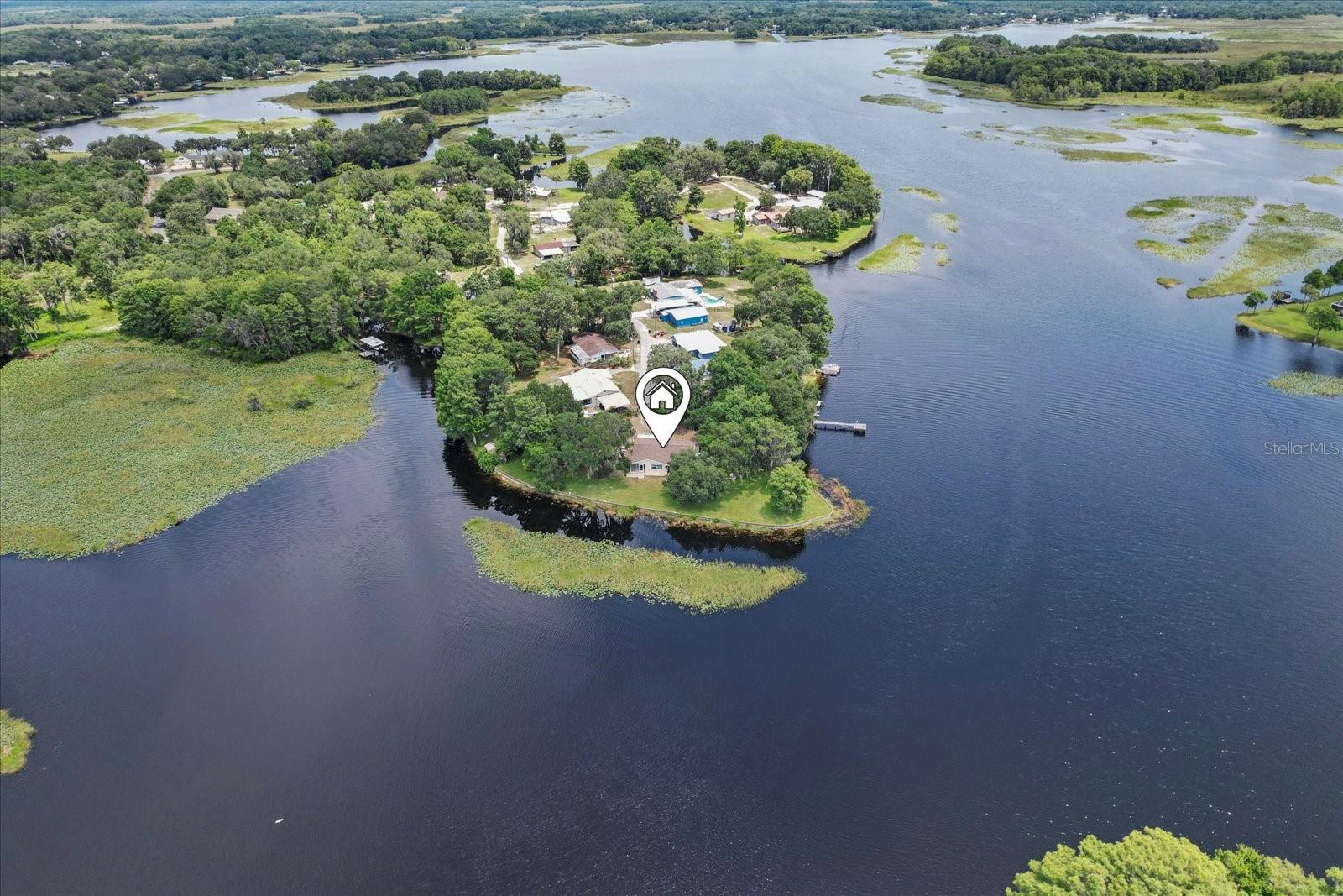Your Private Lakeside Sanctuary Awaits in Inverness! Imagine owning a piece of paradise where privacy meets convenience on a secluded peninsula with breathtaking open freshwater lake frontage. This inviting 3-bedroom, 1.5-bathroom home with a new roof sits on a sprawling .74-acre lot at the quiet end of a dead-end street, ensuring ultimate tranquility. Boating, fishing, or simply enjoying spectacular sunsets – the lake is your backyard. Yet, you're just moments away from the charm and excitement of downtown Inverness, putting shopping, dining, and entertainment at your fingertips. Practical needs are met with a spacious detached garage and two carports, providing ample storage and parking. The screened back porch with an awesome water view is a dedicated space for peace and contemplation right at home. This isn't just a house; it's an opportunity to embrace a serene, connected, and deeply personal lifestyle on the water.