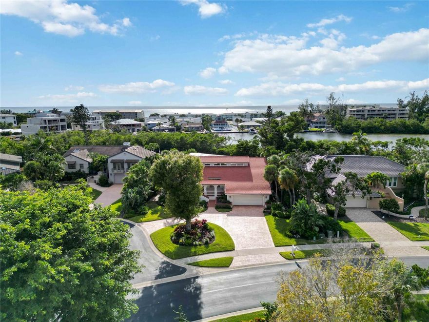 Under contract-accepting backup offers. A boater’s delight in the heart of Bay Isles on exclusive Longboat Key, a Coastal double gated community. See our homes 3-D and Bay Isles video tour links. Your home enjoys easy access to the Gulf in just 17-20 minutes from your private dock. The "J" shaped dock features a 44’ slip with 30,000 lb. lift, 100 linear ft. of Trex decking, jet ski/kayak launch, shore power of 30 & 50 amp, and water. This custom Florida coastal home offers 2,849 sq. ft. of light-filled living space in a split plan with 3 bedrooms (double master suite), 3 baths (2 en-suite), a front den, and loft (little ones will love this). A lush and private one-third acre setting with circular driveway surrounded by a neatly manicured landscape kept green by reclaimed irrigation water. Your home features a heated pool and cascading spa with (brand new gas pool heater and brand-new pebble body finish), expansive covered paver lanai for sunbathing, natural gas grill hook-up, pre plumbed for an outdoor kitchen and serene views of Crane’s Bayou and Gulf sunsets. Inside, discover 15 1/2' vaulted ceiling, wide plank tile flooring in all active living areas, and an open great room design. Show kitchen with new quartz kitchen countertops, glass accent backsplash w/under cabinet lighting, 42” shaker cabinets and two-tone cabinet design, modern appliances, and dual islands perfect for entertaining. Open dining area with dry bar cabinet and wine refrigerator. The primary suite offers a newly remodeled bath, walk-in shower, twin vessel sinks, and custom walk-in closet. Two a/c units for zone air conditioning and two efficient electric water heaters. Residents enjoy membership in the private Bay Isles Beach Club, offering five acres of pristine Gulf-front beach with grills and pavilions (walk the beach to the Monkey Bar for a sunset cocktail). Optional private membership to the Longboat Key Club & Resort provides access to 45 holes of golf, a world-class tennis and pickleball center, deep-water marina, spa, fitness facilities, and fine dining. Just moments away, the new St. Regis Longboat Key Resort offers exceptional restaurants and lounges, including the elegant CW Prime Steakhouse, Riva restaurant, Oshen rooftop lounge, and the iconic Monkey Bar, perfect for sunset cocktails. For daily shopping, a short distance outside the Bay Isles gate is Longboat Key Town Center featuring a full-sized Publix grocery, CVS pharmacy, and nail salon. Bay Isles is minutes to St. Armand’s circle an open-air, European-inspired circular plaza of 130 shops and restaurants. The John Ringling bridge brings you to downtown Sarasota, waterfront park, and marina. Experience the ultimate blend of boating, beach, and luxury coastal living. Living Bayou is a lifestyle, comfort, convenience, and security…. with a Touch of Class.