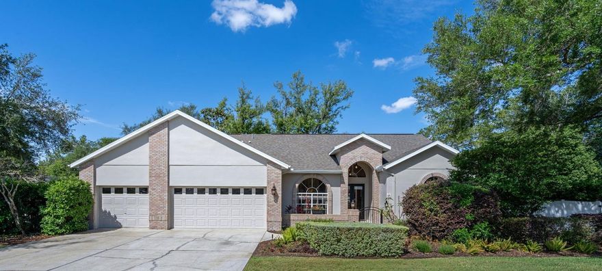 Welcome to your dream home ln the desirable gated community of Gracewood at River Ridge. Lovingly maintained by its original owner, this exceptional property sits on over half an acre of beautifully landscaped grounds. A charming courtyard entry leads into a light-filled, open formal living and dining area. The kitchen features granite countertops, abundant cabinetry, and generous prep space, with a breakfast bar that opens to your spacious family room, complete with wood burning fireplace, and dinette- perfect for everyday living and entertaining. From here, enjoy seamless views of your private pool and lanai. The thoughtfully designed split floor plan offers both privacy and functionality. The expansive primary suite includes  walk-in closets, French doors leading to the lanai, and an ensuite bathroom with dual sinks, soaking tub and private water closet. On the opposite side of the home you'll find three additional bedrooms, along with a guest and pool bathroom that provides convenient outdoor access. The true highlight is the outdoor oasis. Step outside to a large screened lanai, featuring a pool and jacuzzi with a spill over, surrounded by multiple inviting spaces for relaxing and entertaining-whether it's morning coffee, evening gatherings around the firepit, or enjoying the peaceful wildlife-filled backyard that backs to acreage. Additional features include a gazebo, lounging area, and a charming air-conditioned she shed, play house or teen retreat. Mature, lush landscaping enhances the serene atmosphere, creating a private retreat you may never want to leave. The yard is fully fenced and has a double gate for RV or boat storage, as well as a storage shed. For your playful side it also includes a basketball/pickleball pad. (Freshly painted and new faux wood blinds, Roof 2020, Hot water heater 2025, new pool pump, and AC refurbished in 2026) Low HOA and No CDD. Conveniently located near Trinity, Downtown and Uptown New Port Richey and all those world famous beaches. Schedule your private showing today-this one truly stands out!