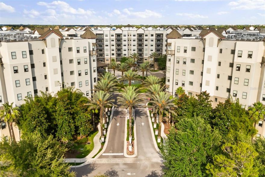 Welcome to this move-in ready condo-hotel residence at The Grove Resort, a world-class, family-friendly destination offering the perfect blend of vacation lifestyle and hands-off investment potential. This bright, modern condo features an open concept layout with natural light, a comfortable living and dining area, and a well-appointed kitchen with warm wood cabinetry, stainless steel appliances, quartz counters, and a breakfast bar. Sliding glass doors open to a private balcony with elevated resort views, creating an easy indoor-outdoor living feel. The spacious primary suite includes a ceiling fan, large window, and en suite bath with dual sinks and a tub/shower combination and a walk in closet, while the secondary bedroom and full guest bath with walk in closet provide flexible accommodations for owners and guests. In-unit laundry adds convenience, and professional on-site hotel management helps handle bookings, guest services, and maintenance. The Grove Resort offers exceptional amenities including Surfari Water Park with a FlowRider surf simulator, dueling water slides, lazy river, splash park, activity pool, zero-entry pool, private cabanas, multiple resort pools, hot tubs, a 20-acre activity lake, private dock, on-site dining, bars, market, arcade, game room, full-service spa, fitness center, and shuttle transportation to Disney World, Universal Studios, and SeaWorld. A strong option for a personal vacation retreat, short-term rental, or income-producing investment near Orlando’s world-famous attractions.