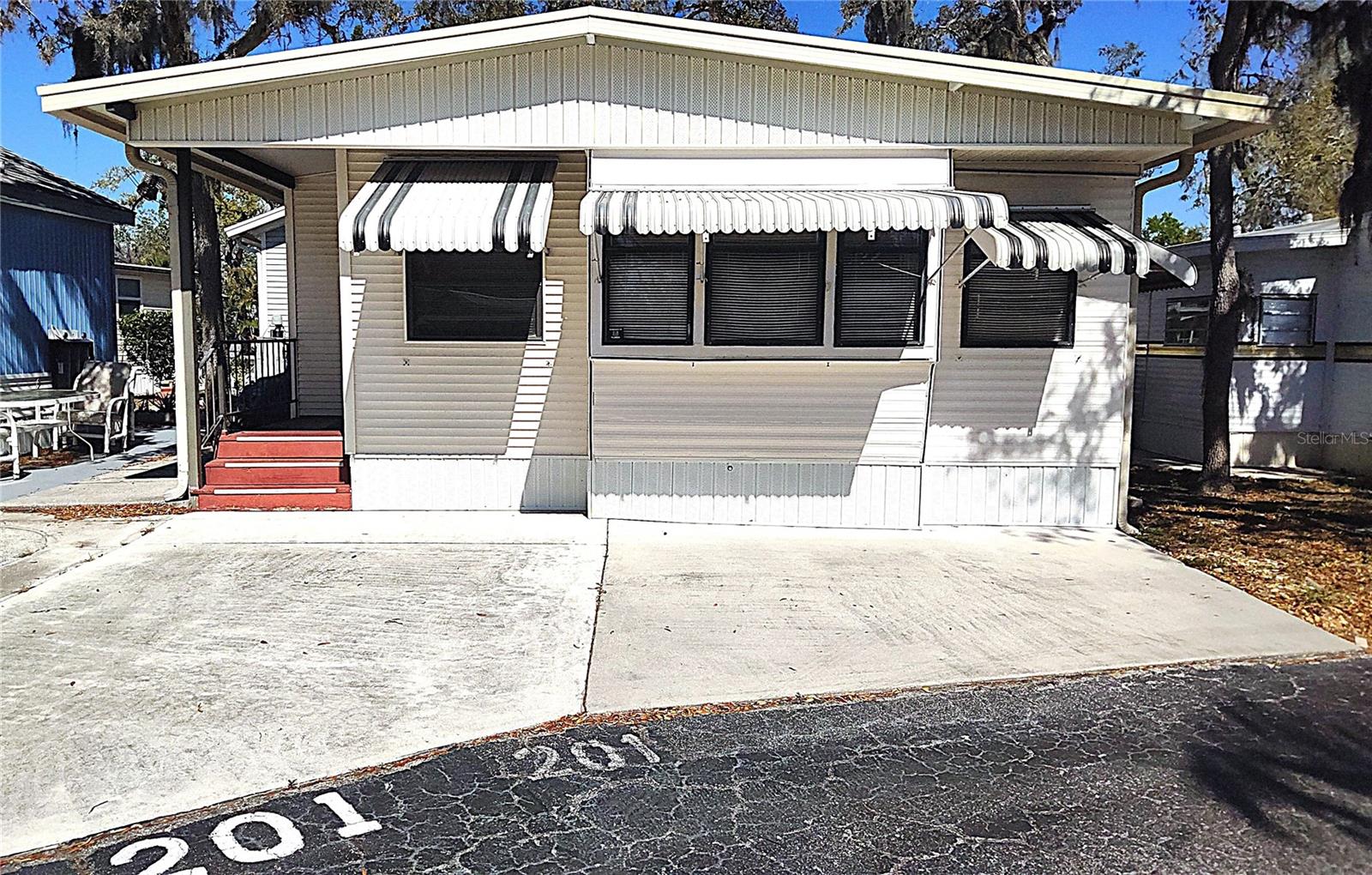 Best value in this park! This vibrant 55+ community provides many winter time activities to keep you busy. Large heated pool, tennis, pickleball, shuffleboard, billiards and a miniature golf course! This home features 1 bedroom and 1 bath. Newer floors and newer water heater. This home is just waiting for some TLC. This community does require a minimum credit score of 750 to purchase.