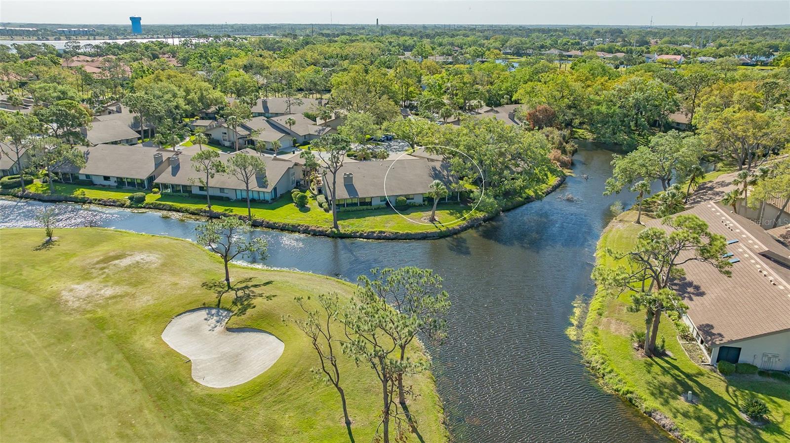 The crown jewel! Exquisite renovation with spectacular peninsular views plus hurricane-ready in The Meadows, a 1,600-acre oasis in an enviable location. A canopied street, paver driveway and private front patio welcome you home on a quiet cul-de-sac. Inside, prepare to fall in love with a stunning top-to-bottom transformation that reimagined the layout to maximize space, light and the mesmerizing vistas of the shimmering pond and distant golf course. You’ll be pampered with the best of everything including pearl-finish Lauzon White Oak Beachwood hardwood floors, PGT impact windows and sliders, custom solid wood soft-close cabinetry adorned with Restoration Hardware pulls, Pure White Caesarstone countertops, and a chef’s dream kitchen equipped with Sub-Zero refrigerator, Miele dishwasher, Wolf cooktop with Tamburo Zephyr hood, GE Monogram built-in ovens, under-cabinet lighting and marble tile backsplash. The Florida room is ideal for enjoying quiet mornings watching bird life on the pond, cozy afternoons with a book and hosting friends. Relax in the spacious primary suite featuring double walk-in customized closets, double vanities and frameless glass Roman shower. All adorned by spectacular pond and golf course views, a block to the heated community pool and hot tub, and a quick ride to all the fun The Meadows has to offer. The Meadows, 1,600 park-like acres in an enviable location, is a resort lifestyle community 15 minutes from downtown. Residents enjoy 14 miles of trails, fun activities, fitness center, Junior Olympic pool, 10 pickleball courts, dining venues plus pay-to-play three 18-hole golf courses and a top-notch tennis complex. You’ll live near award-winning beaches, remarkable arts and culture, Nathan Benderson Park, Mote SEA Aquarium, Whole Foods, Trader Joe’s and The Mall at University Town Center, a world-class shopping, entertainment and dining destination. A fabulous Florida lifestyle awaits. A 2023 22 SEER high-efficiency air-conditioning system, 2022 water heater, 2021 hurricane garage door, 2017 dimensional-shingle roof, impact windows and sliders, above flood plain in flood zone X.